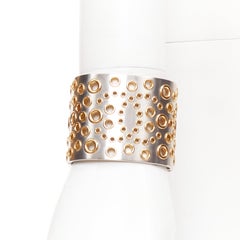 CHANEL B16 silver tone gold CC logo punctured grommet eyelet cuff bangle