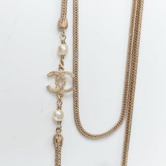 CHANEL B16A gold tone faux pearl CC logo round globes necklace