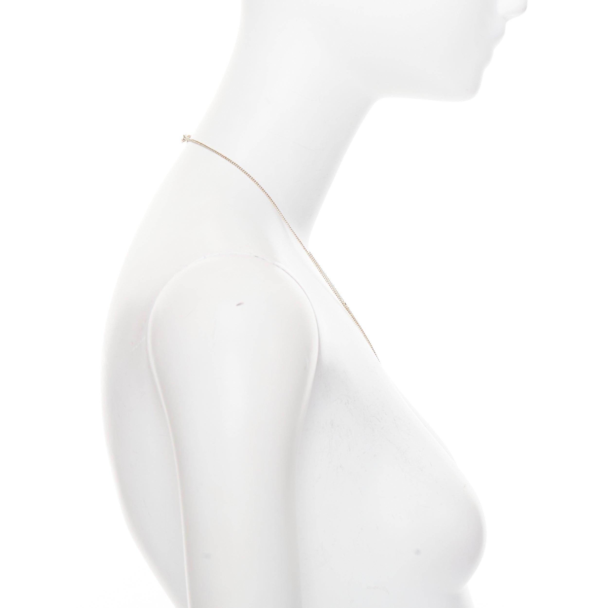 CHANEL B21S Collier pendentif médaillon avec logo CC en champagne doré Pour femmes en vente