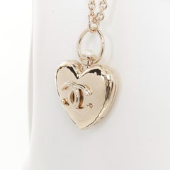 CHANEL B22C AB7531 Giant Heart Locket gold plated CC locket long chain necklace