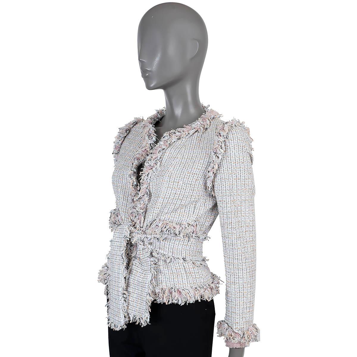 100% authentic Chanel belted tweed jacket in baby blue, beige and pink cotton (55%), polyester (27%) and nylon (18%). Features fringe trim along the seams and cuffs and two open pockets at the waist. Closes with a self-tie belt and is lined in silk