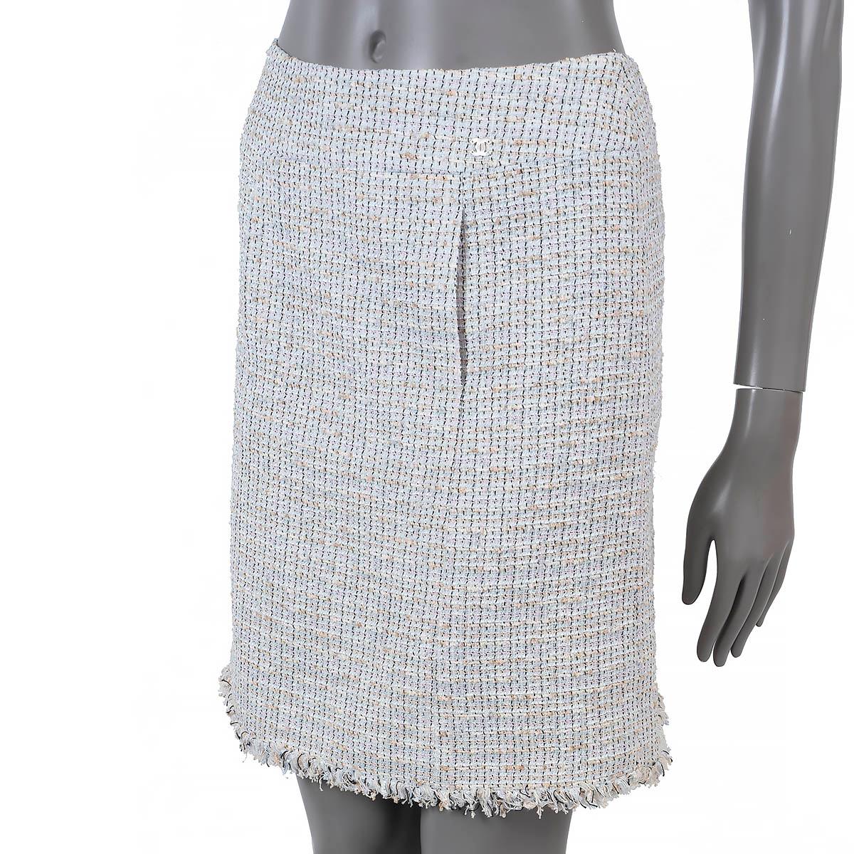 100% authentic Chanel above-knee tweed skirt in baby blue, beige and pink cotton (55%), polyester (27%) and nylon (18%). Features two slit pockets and a fringed bottom hem. Closes with a concealed zipper in the back and is lined in silk (100%). Has