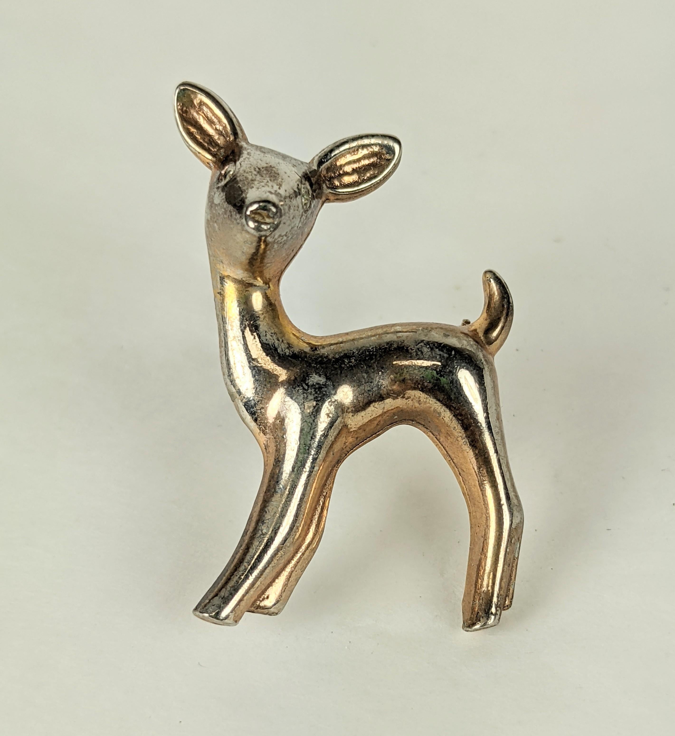Chanel Baby Deer Brooch with paste eyes made by Reinad for the American market. Chanel script signature, not associated with the house in Paris, but the Chanel Novelty Co. Gilding is off to a silver color. 1