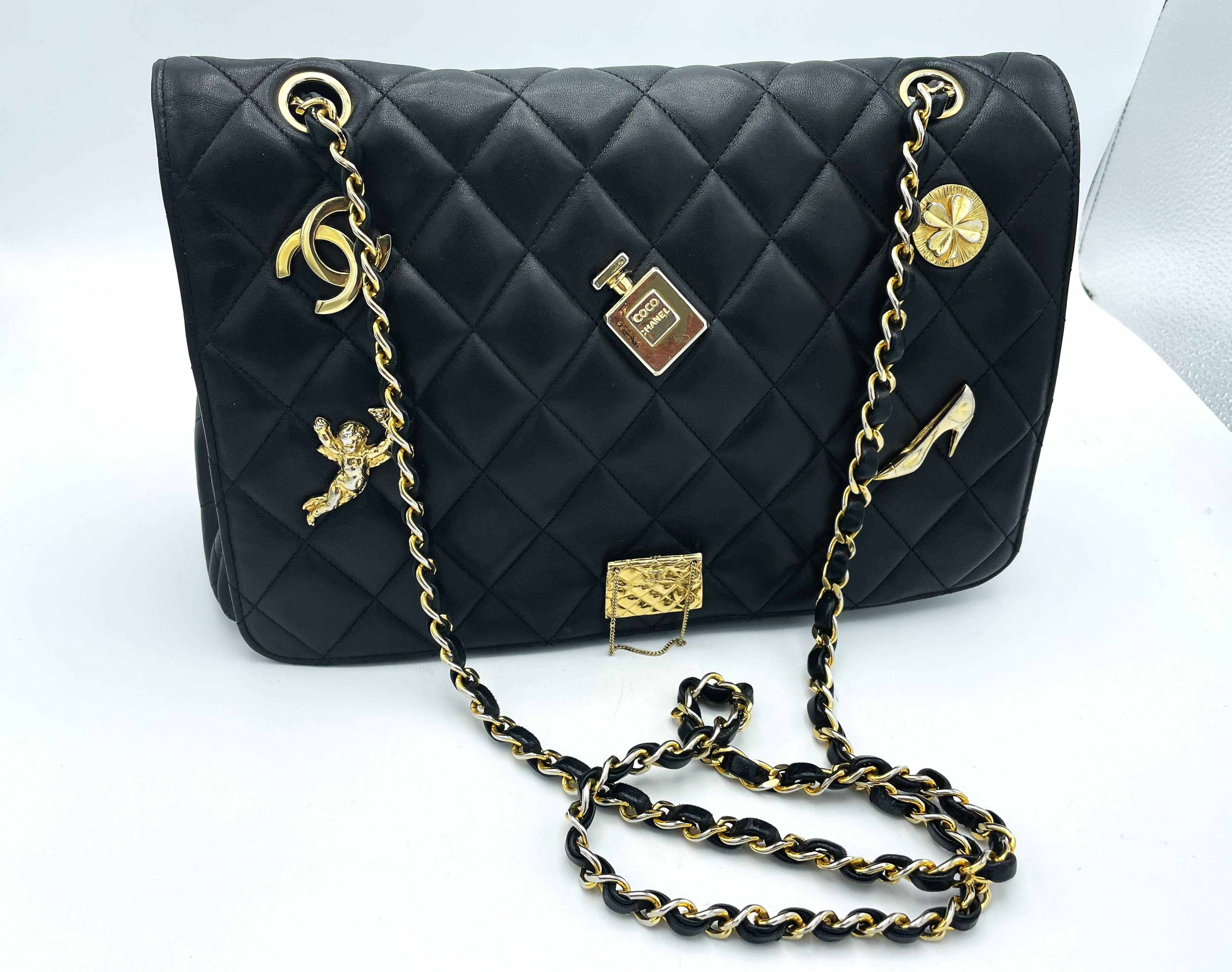 Black TIMLESS CHANEL BAG, black lambskin, with 6 iconic charms, collection 1994/96 For Sale
