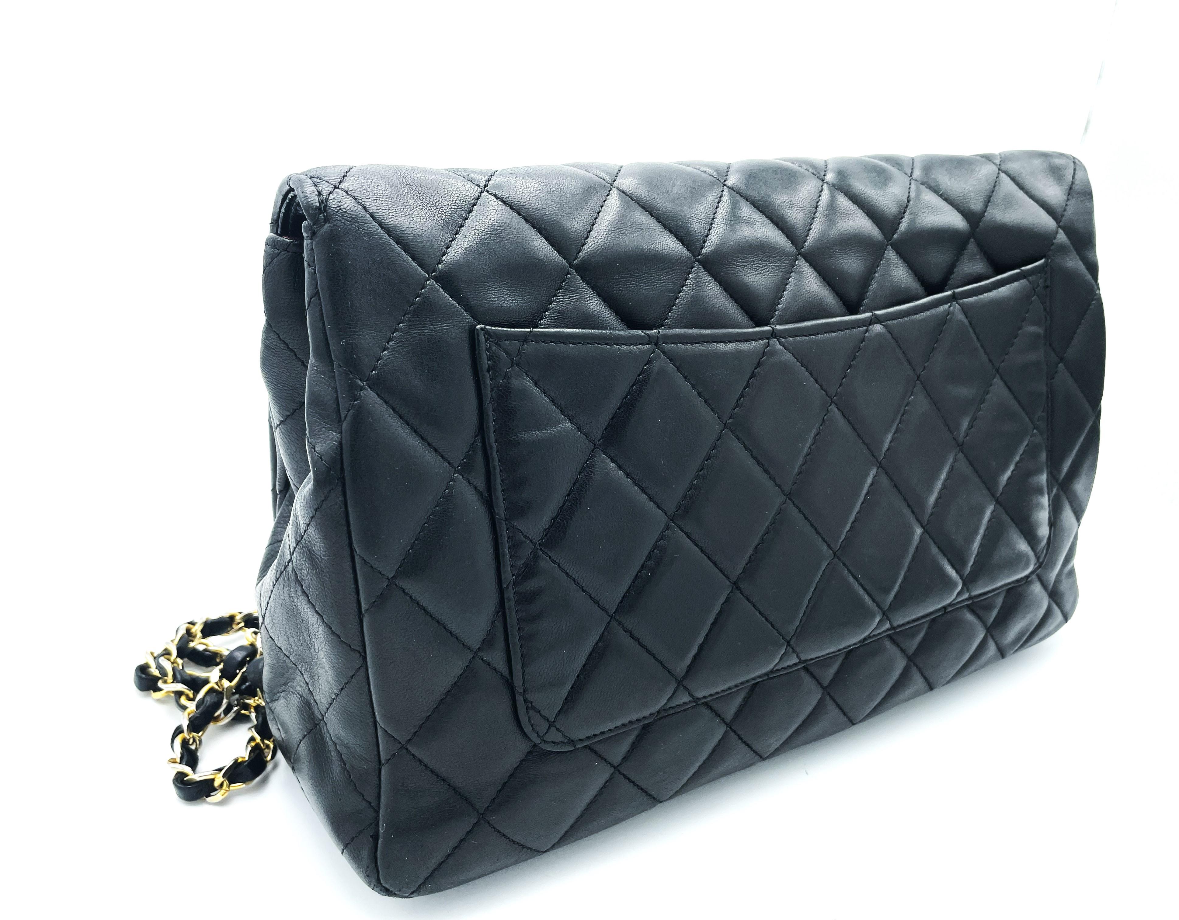 Women's TIMLESS CHANEL BAG, black lambskin, with 6 iconic charms, collection 1994/96 For Sale