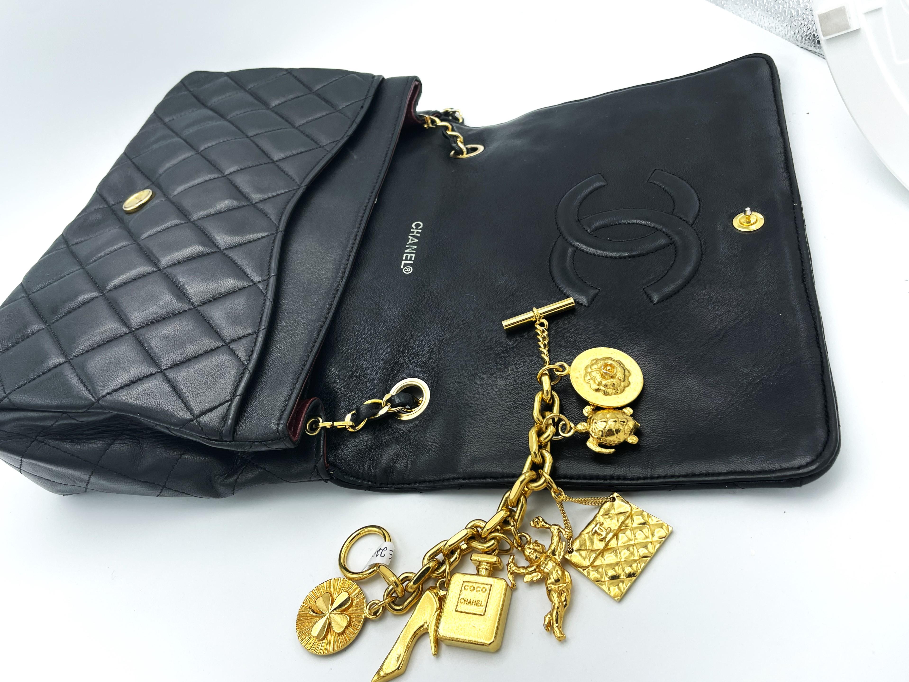 TIMLESS CHANEL BAG, black lambskin, with 6 iconic charms, collection 1994/96 For Sale 2