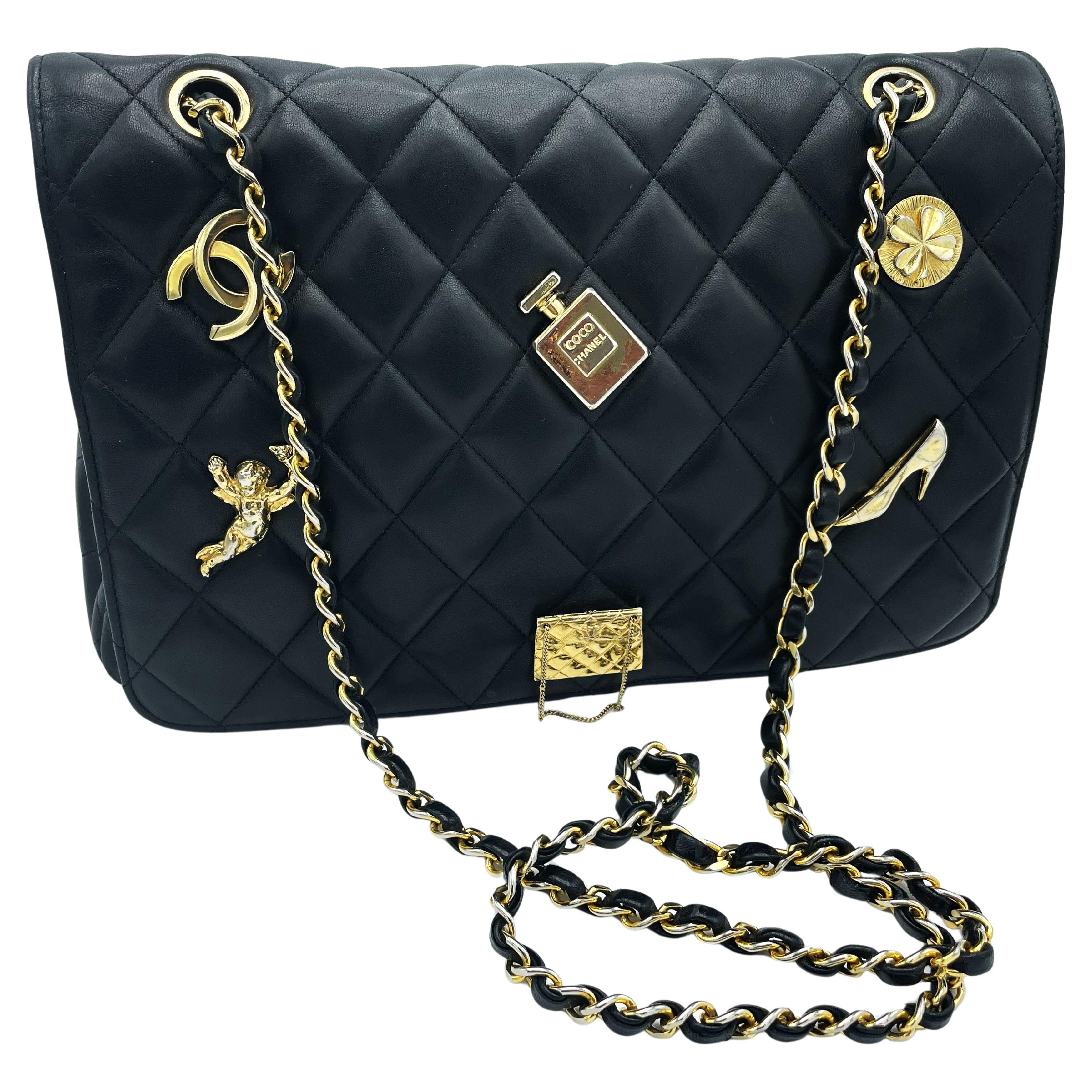 TIMLESS CHANEL BAG, black lambskin, with 6 iconic charms, collection 1994/96 For Sale