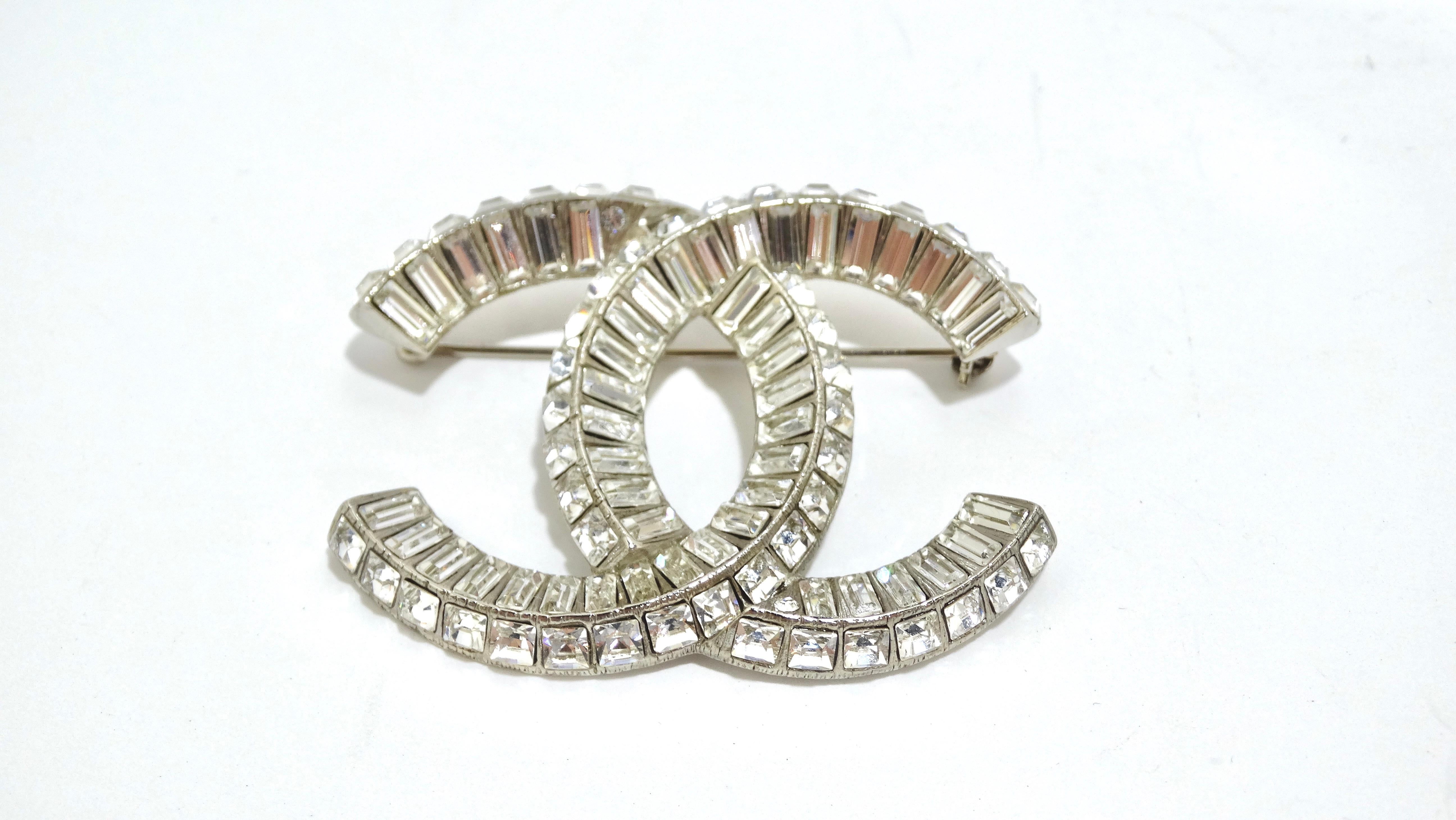 Who does't love a little sparkle? From the 2016 Autumn Collection, this elegant brooch is a large silver Chanel CC logo lined with baguette crystals. Add this to any outfit to elevate the look ten notches. Pair this brooch with a Gucci skirt suit