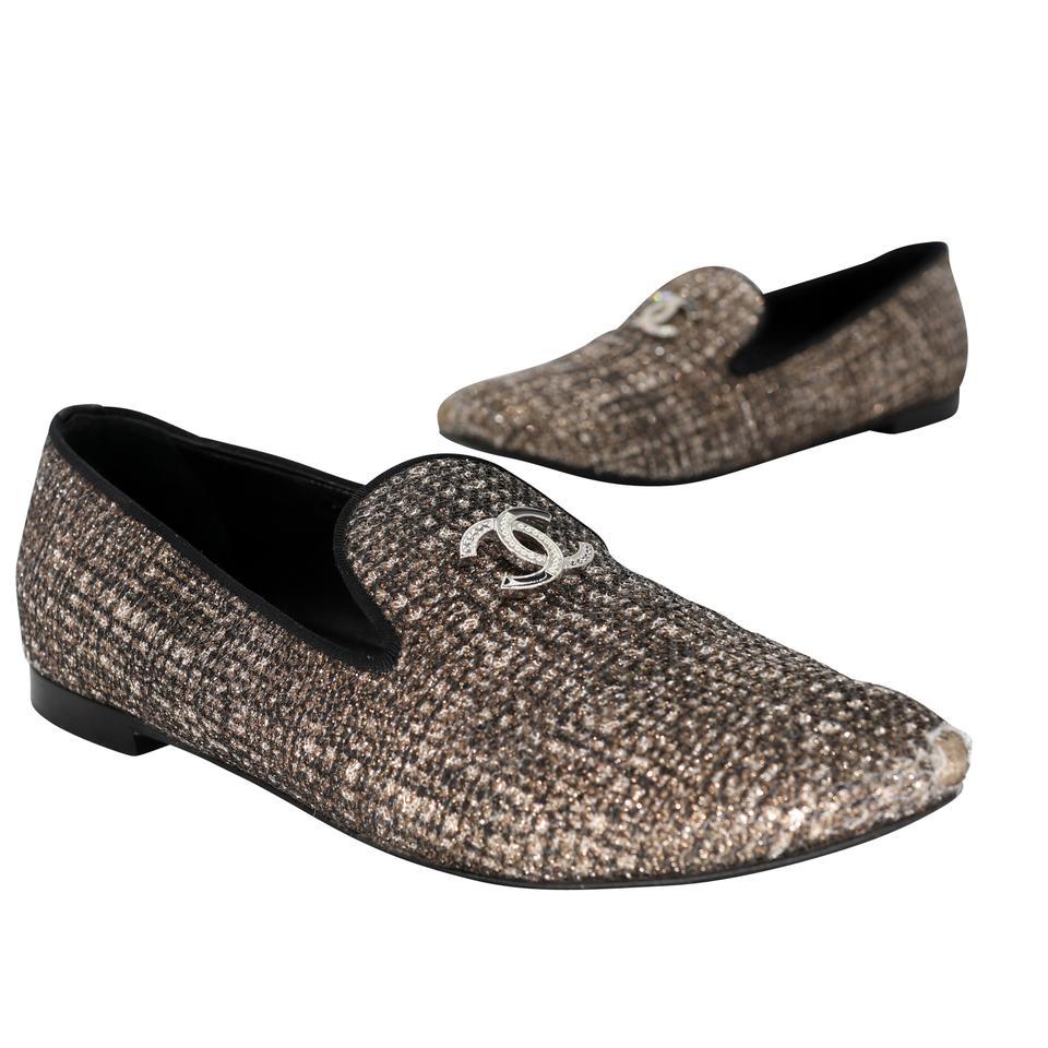 These classic and versatile Chanel slip on flats are iconic and must-haves for any fashionista. Luxurious tweed style with big CC charm logo and crystal detail trim set these adorable flats apart from the rest. Soft supple leather interior lining