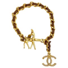 CHANEL Bambi Bracelet in Gilt Metal interlaced with Brown Leather