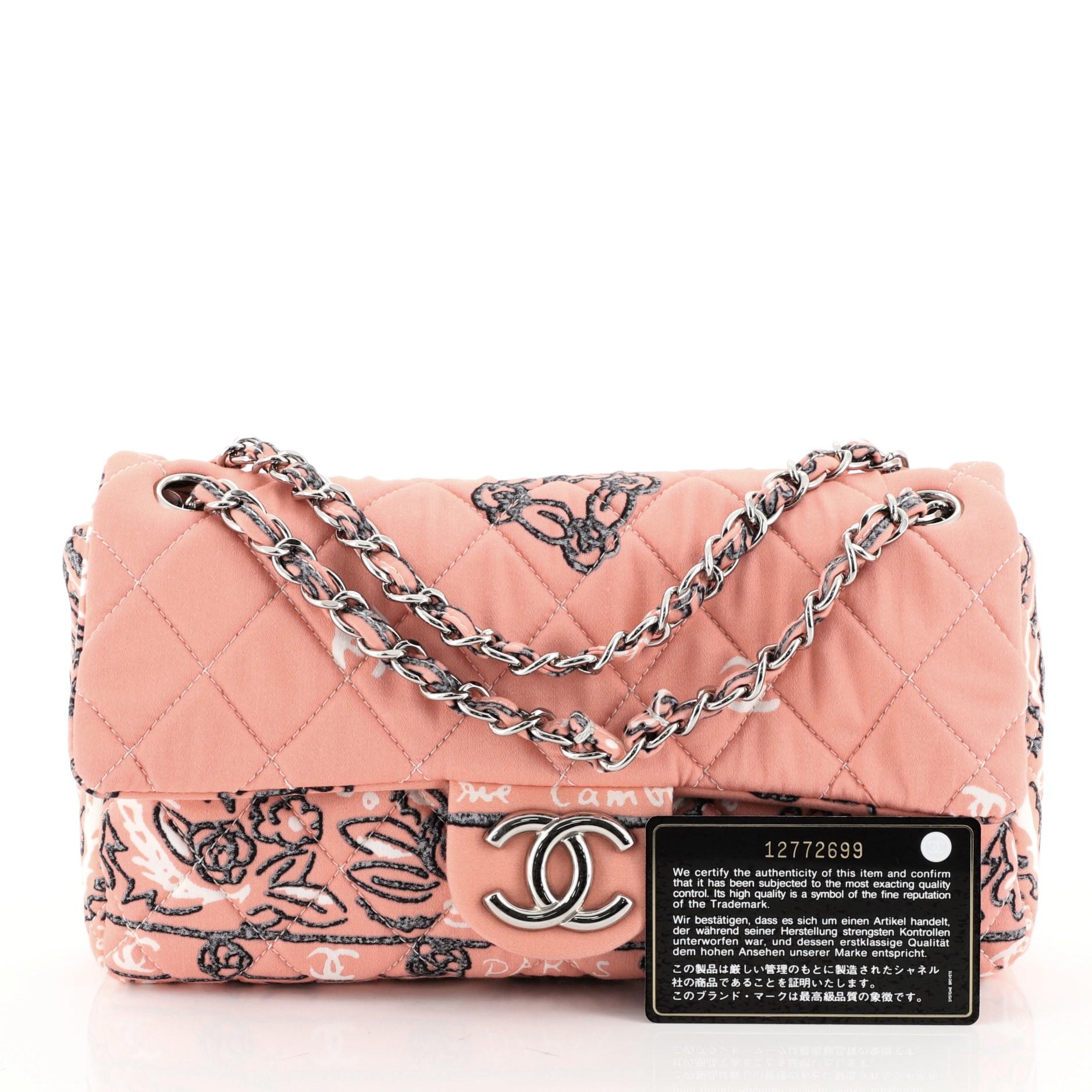 This Chanel Bandana Flap Bag Quilted Canvas Medium, crafted from pink quilted canvas with bandana-inspired print, features woven-in canvas chain strap, CC logo on the flap and silver-tone hardware. It opens to a neutral fabric interior with zip