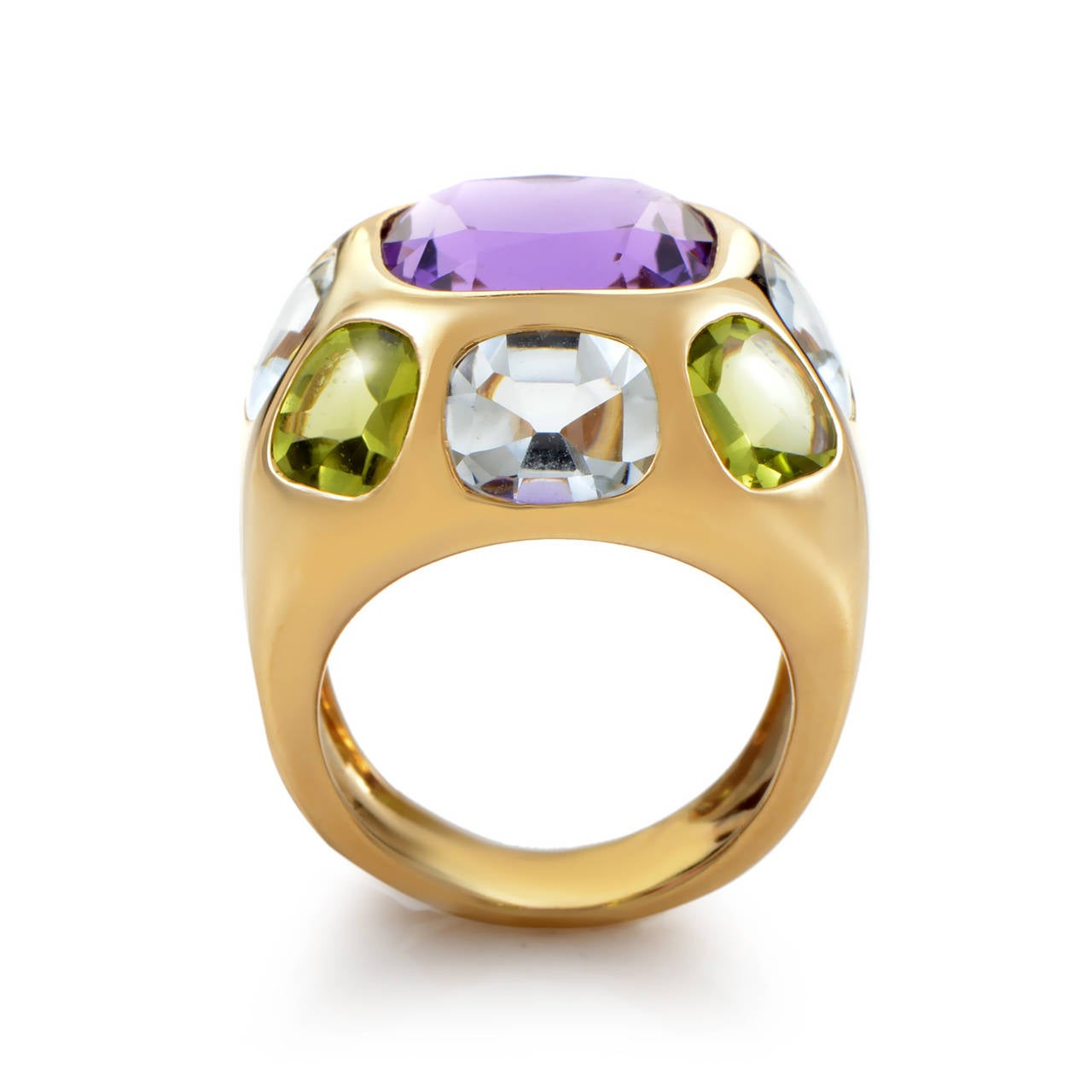 Flawlessly forged 18K yellow gold presents a worthy platform for multiple stones. Amethyst, aquamarine, and peridot make bold statements at the crest of this ring's smooth taper.

Included Items: Manufacturer's Box
Ring Size: 5.5