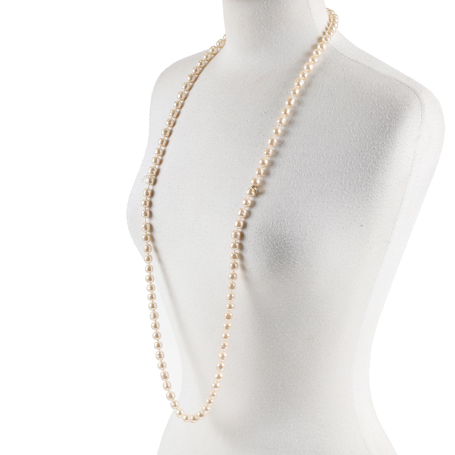 This authentic Chanel Baroque Pearl Single Strand Necklace is in mint condition.  A beautiful piece from 1981, this collectible goes with everything from t shirts to evening gowns.
Champagne colored large baroque pearls.  Long length, 36” total. 