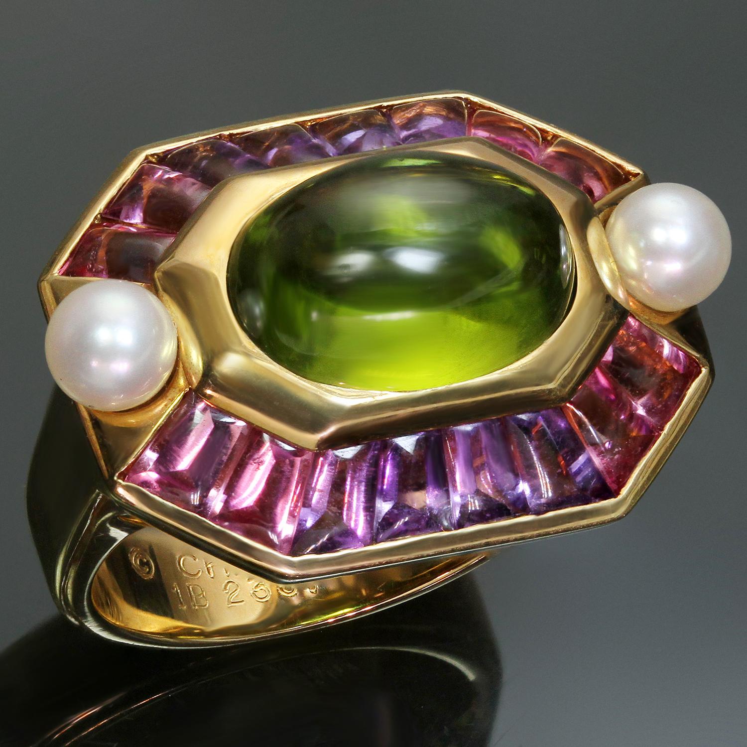 This stunning Chanel ring from the vibrant and opulent Baroque collection is crafted in 18k yellow gold and set with a cabochon oval peridot in the center, surrounded with cabochon baguette amethysts, and completed with a pair of cultured pearls.