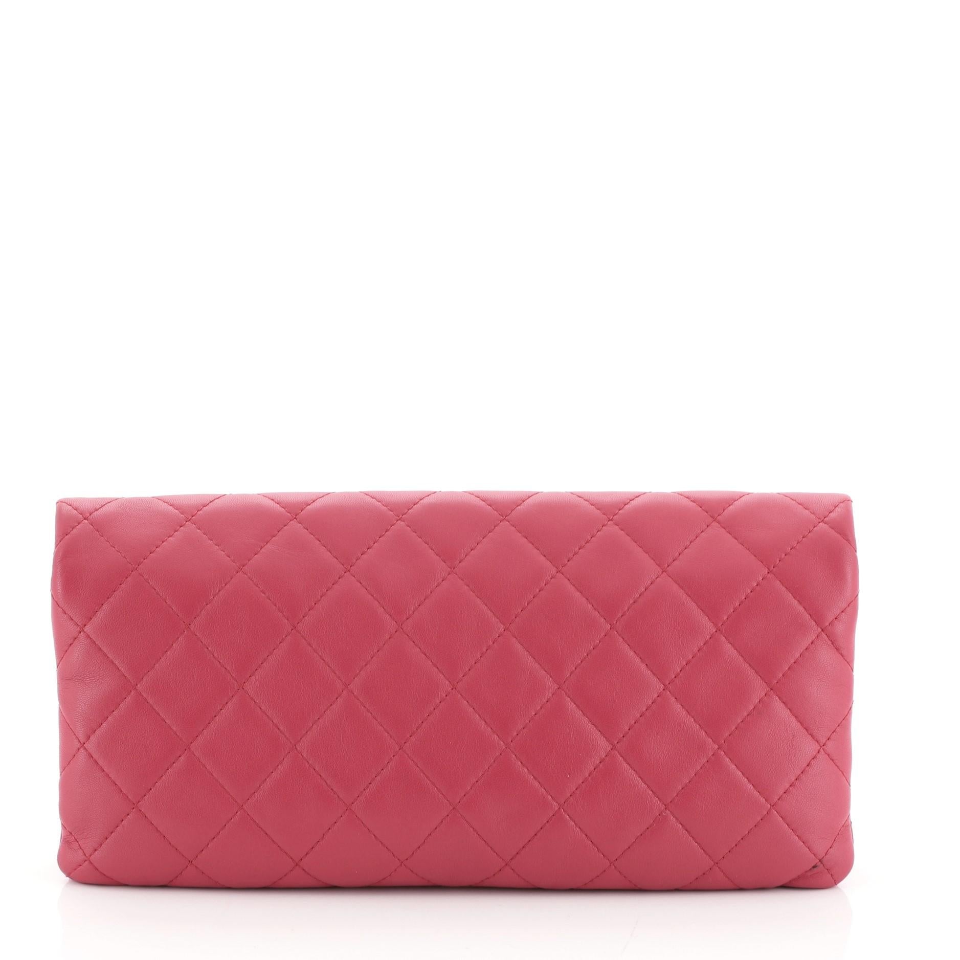 This Chanel Beauty CC Clutch Quilted Lambskin, crafted from red quilted lambskin leather, features CC logo at front and gunmetal-tone hardware. Its fold over flap with zip closure opens to a red satin interior. Hologram sticker reads: 21049723.