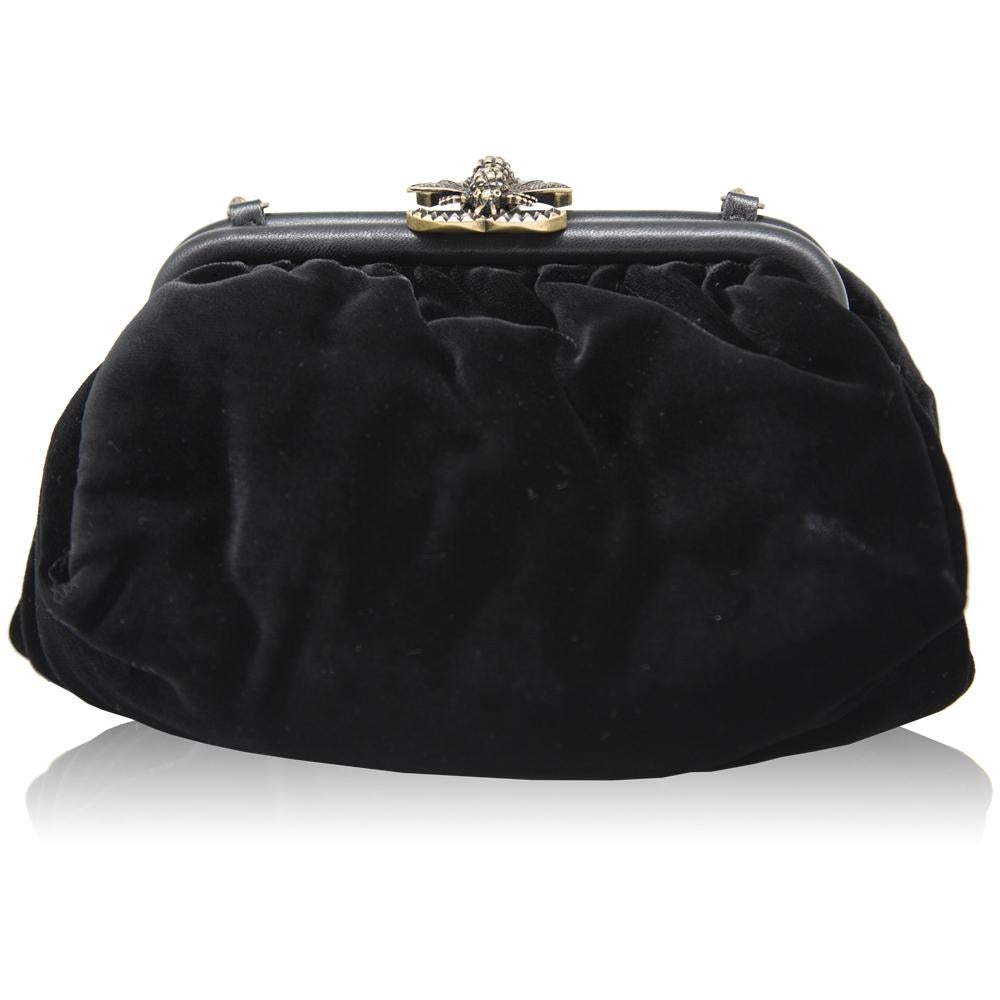 A rare design from Chanel, this pre-owned, half-moon shaped handbag is an unusual piece that easily moves from day to night. Crafted from pure velvet, its classic black hue is accented by gold-tone hardware and features the iconic chain-link