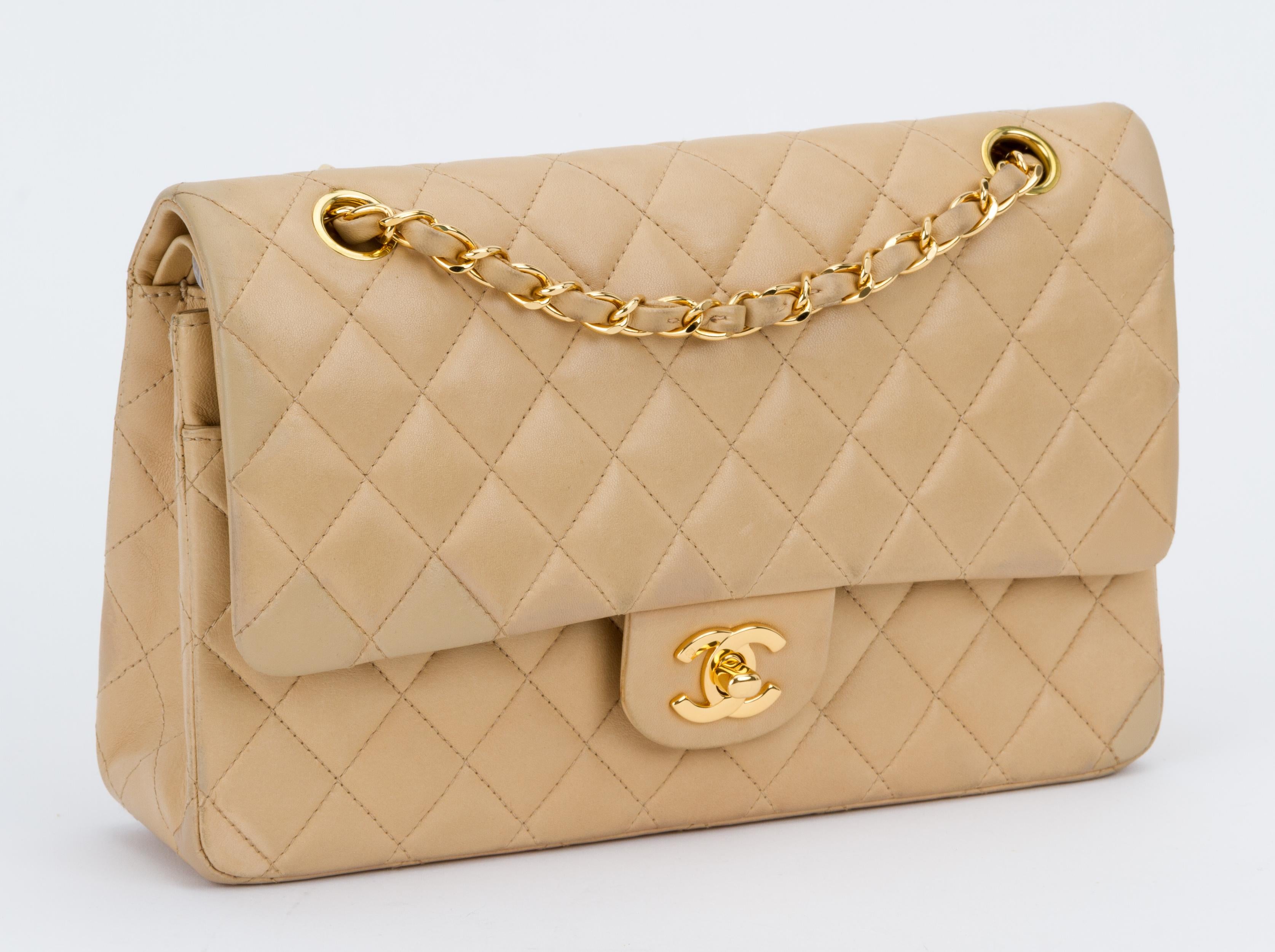 Chanel quilted double flap classic medium bag in beige leather and gold tone hardware. Shoulder drop, 9