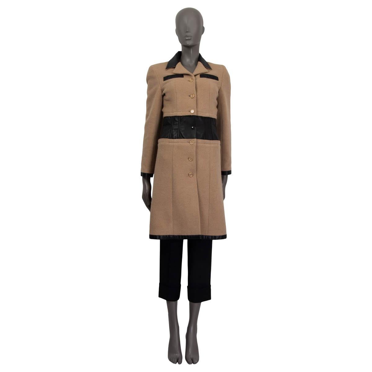 100% authentic Chanel Fall/Winter 2001 coat in sand camel hair (97%) and spandex (3%). Features a calf skin leather trim and two sewn shut slit pockets. Opens six 'CC' buttons and one push button on the front. Lined in beige silk (100%). Has been