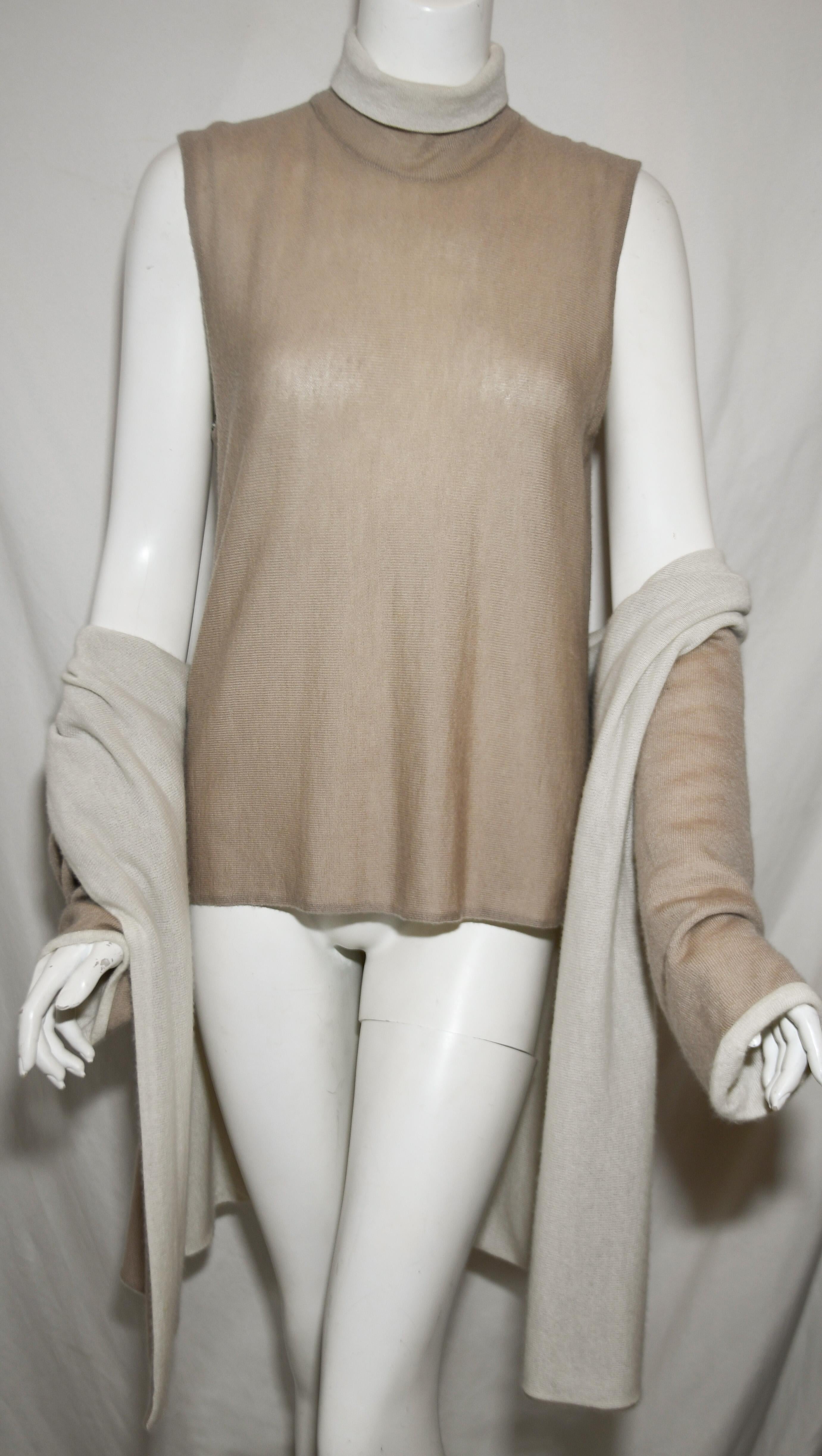 Chanel beige and ivory cashmere sweater set contains a cashmere shell with a mock turtle neck collar in contrasting color.  The jacket, also has a contrasting color of either beige or ivory.  This ensemble can be worn on either color if Hermes