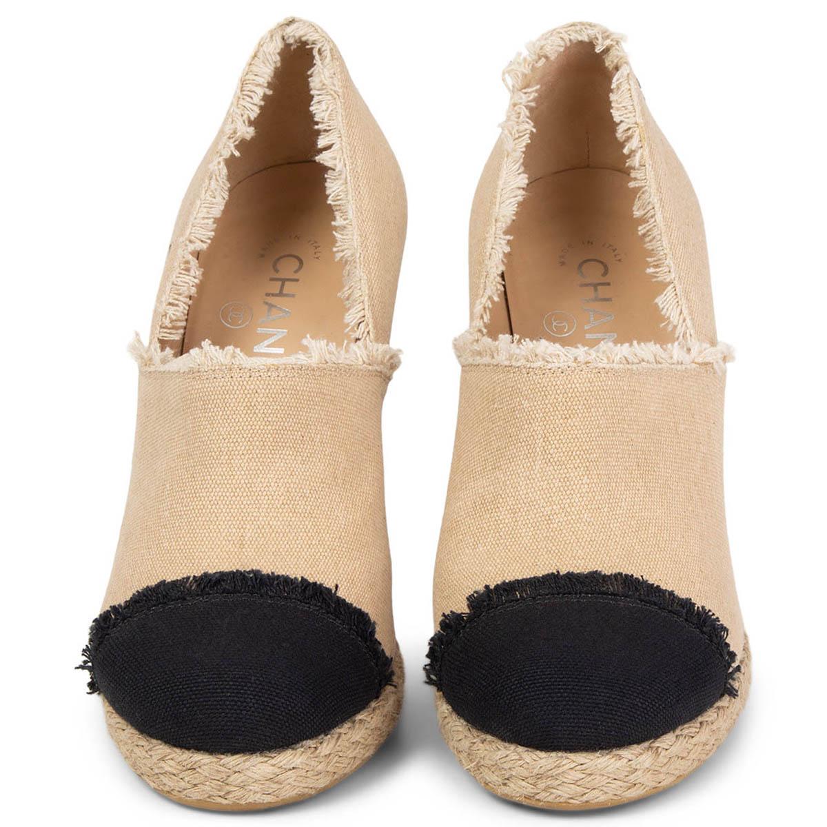 100% authentic Chanel espadrilles pumps in beige and black fringed canvas. Have been worn once and are in virtually new condition. Come with dust bag. 

Spring/Summer 2014 collection.

Measurements

Imprinted Size	38C
Shoe Size	38
Inside Sole	25cm