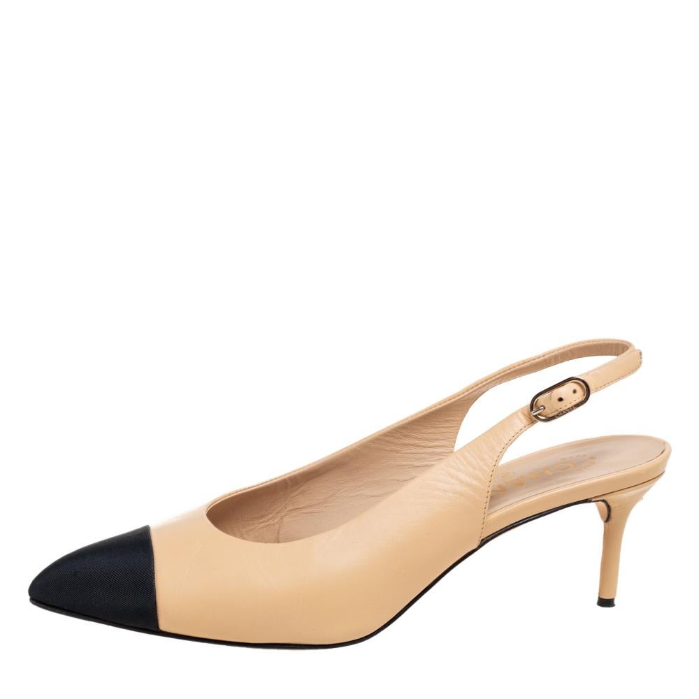 These slingback pumps from Chanel will undoubtedly bring the brand's graceful style and chic aesthetic to your feet. They are created using beige and black leather and canvas and display cap toes. A petite gold-toned CC logo adorns the back. These