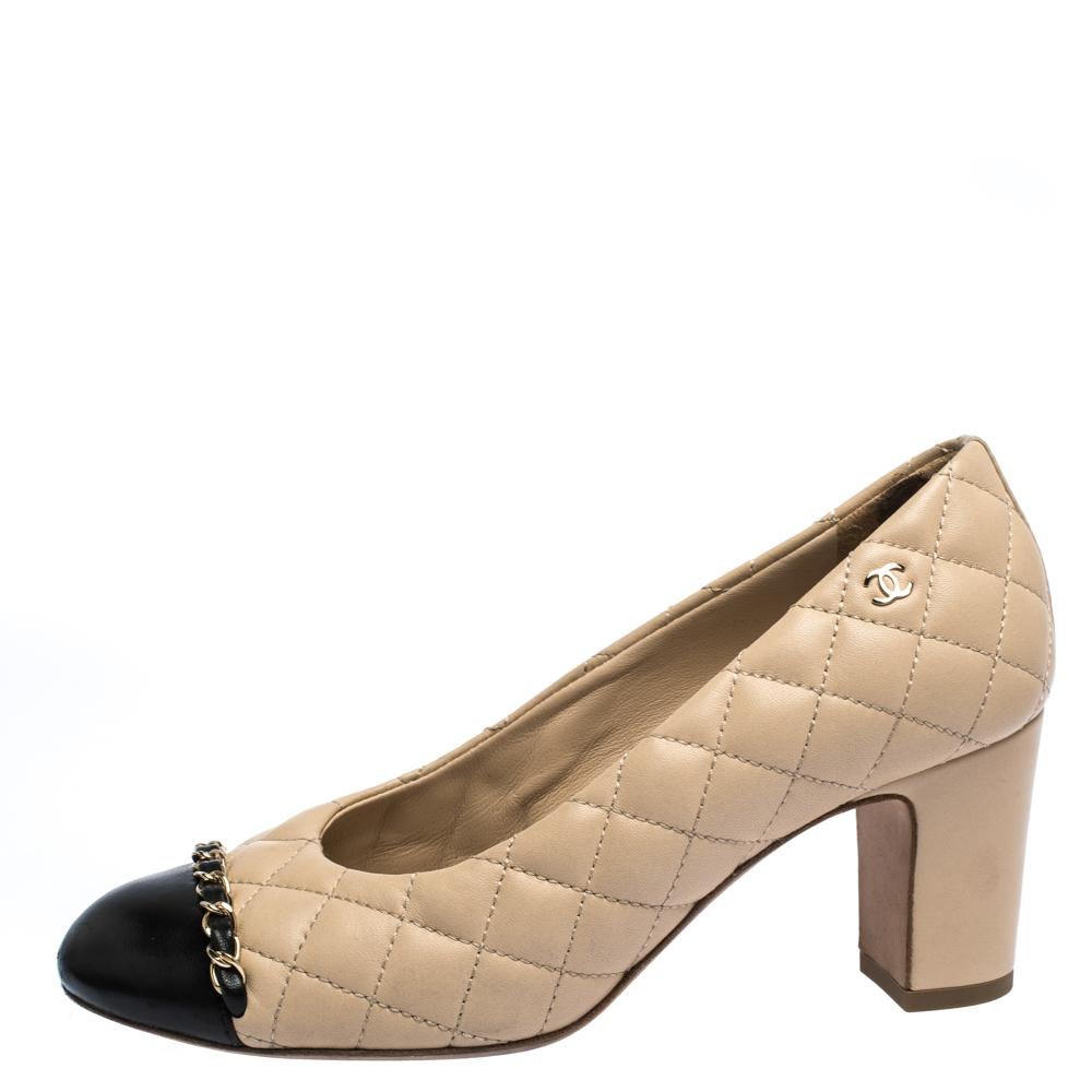 Pick your favourite pair of leather pumps and flaunt your stylish side. Chanel is an ideal pick when it comes to choosing the correct footwear for yourself. This black & beige pair has round cap toes, block heels and chain trims near the toes. Look