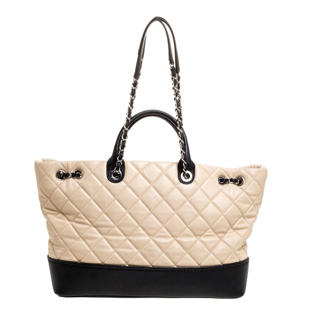 This shopper tote from Chanel is a creation meant to assist you with style and ease. It comes crafted from quilted leather. Two handles and shoulder chains are provided for you to carry it and a spacious interior is to house your belongings. It is