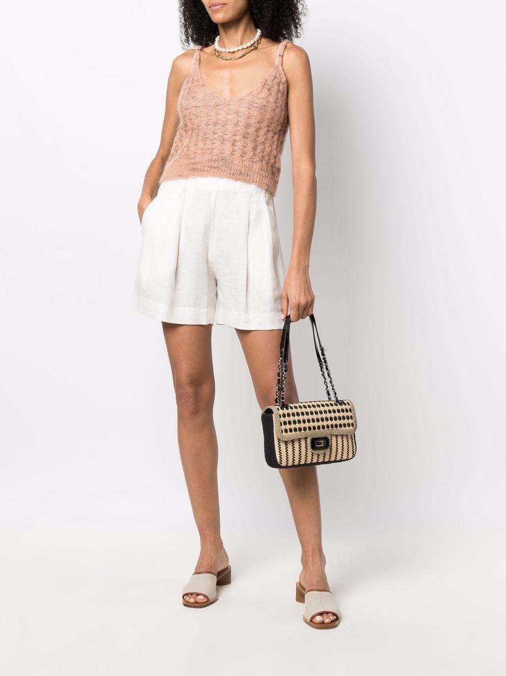 Chanel raffia black canvas flap with mademoiselle clasp closure and interwoven patent chain

Year: 2012
Gold hardware
Classic interior zipper pocket
Interior black canva lining
Classic back pocket
Strap Drop: 10.5
