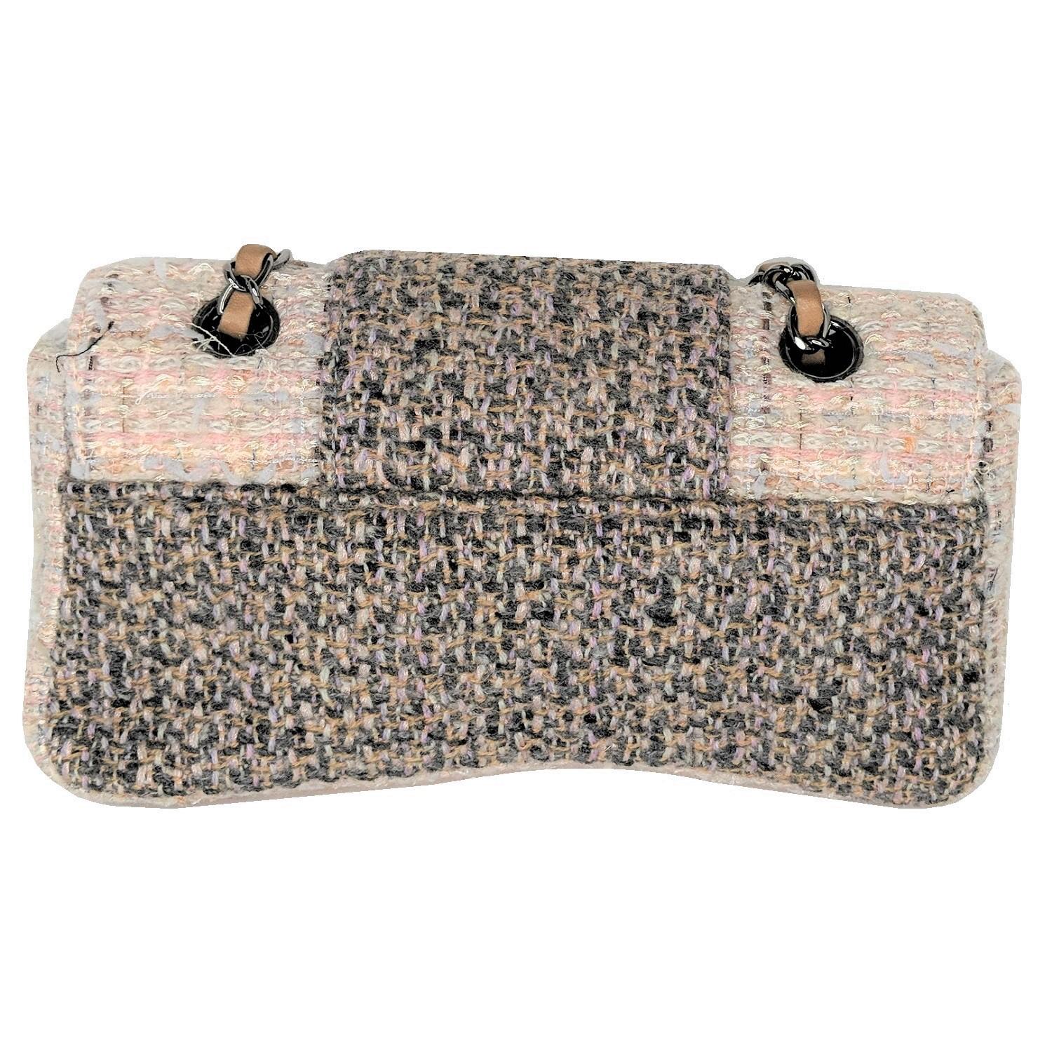 Go in sophisticated style with this Chanel Beige/Brown Tweed Medium Flap Bag. It features a lovely pale beige, brown and white multicolor quilted tweed blend with a flap tab and ruthenium-tone turn-lock CC closure. The feminine touches of this bag