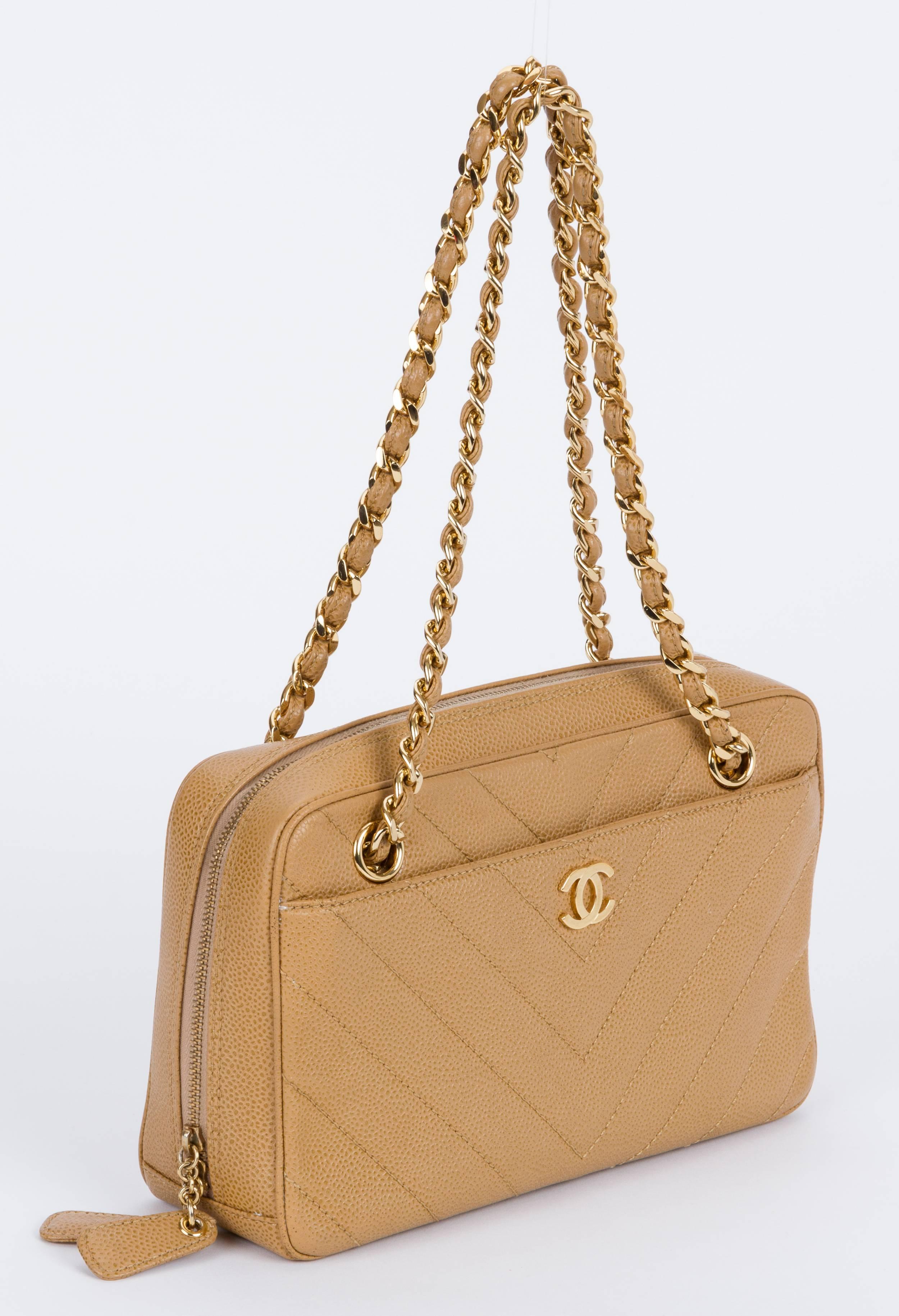 Chanel beige caviar leather zipped handbag with gold tone hardware. Shoulder drop 8.5