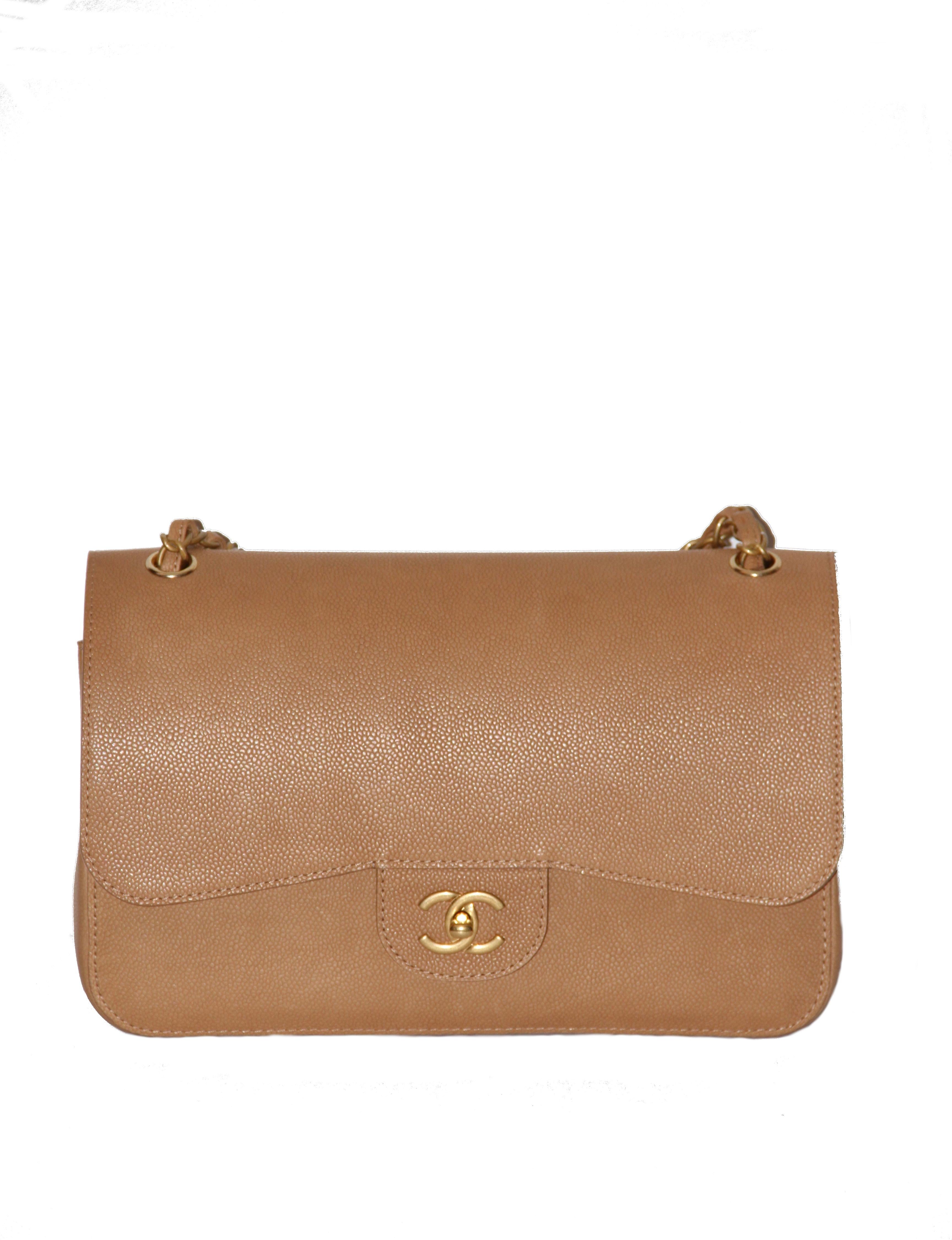 This pre-owned Chanel Limited Edition Jumbo Classic Double Flap bag is made of an unquilted beige grained calfskin leather.

It features a front flap with signature CC turnlock closure, a half moon back pocket, and an adjustable interwoven gold tone