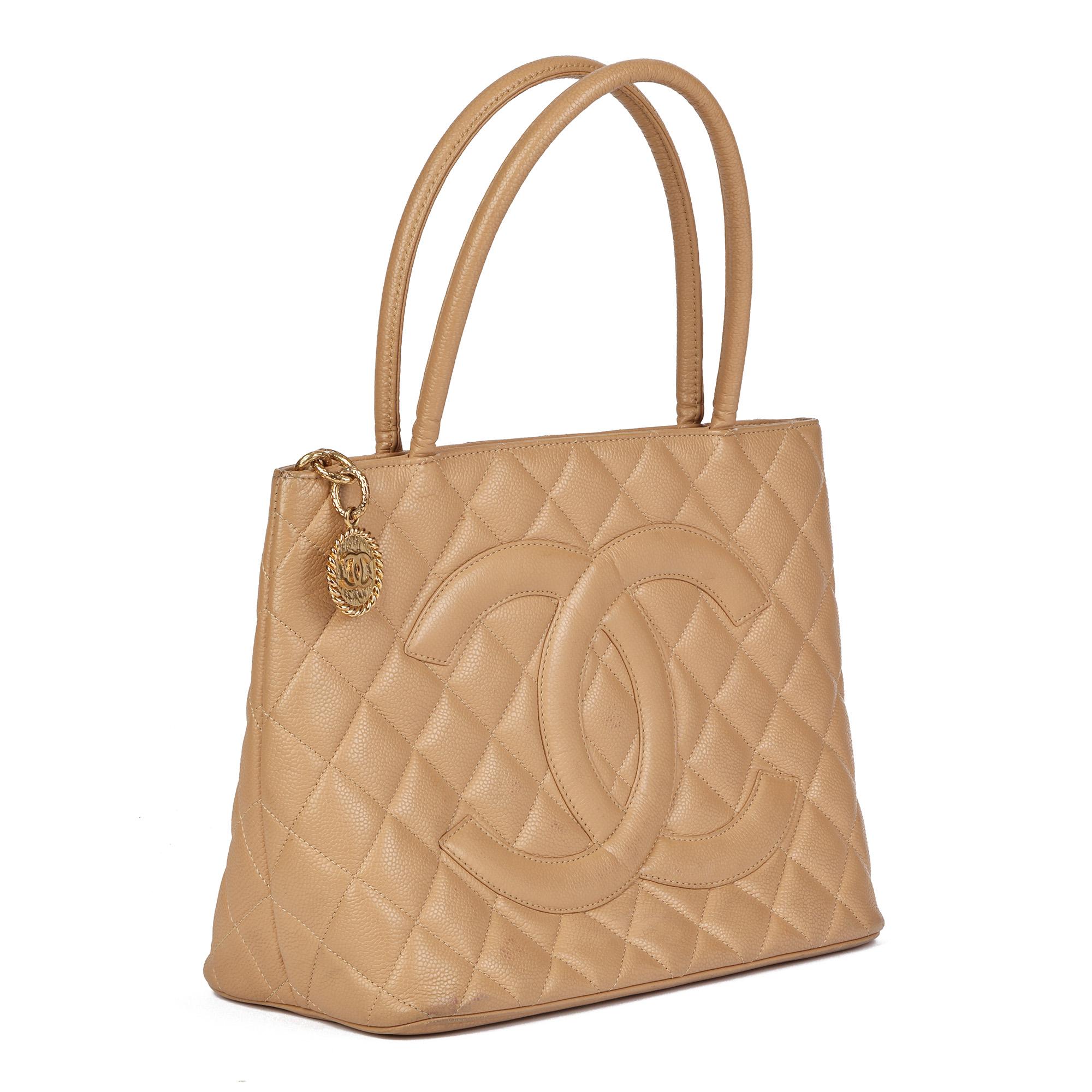 CHANEL
Beige Caviar Leather Medallion Tote 

Serial Number: 11546870
Age (Circa): 2008
Accompanied By: Chanel Dust Bag
Authenticity Details: Serial Sticker (Made in Italy)
Gender: Ladies
Type: Tote

Colour: Beige
Hardware: Gold
Material(s): Caviar
