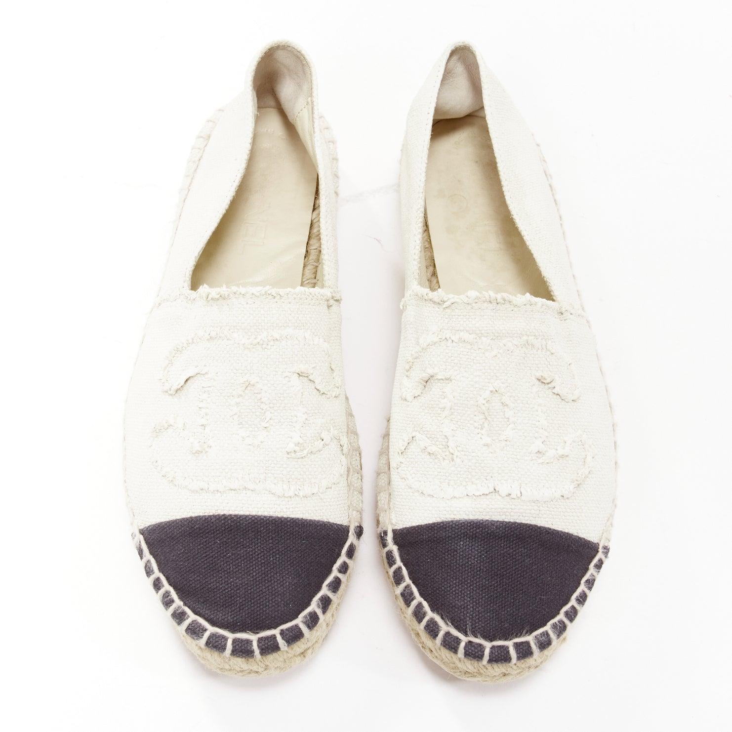 CHANEL beige CC logo fray edge canvas black toe cap espadrille shoes EU38
Reference: NILI/A00062
Brand: Chanel
Material: Canvas
Color: Nude, Black
Pattern: Logomania
Closure: Slip On
Lining: Nude Leather
Made in: Spain

CONDITION:
Condition: Good,