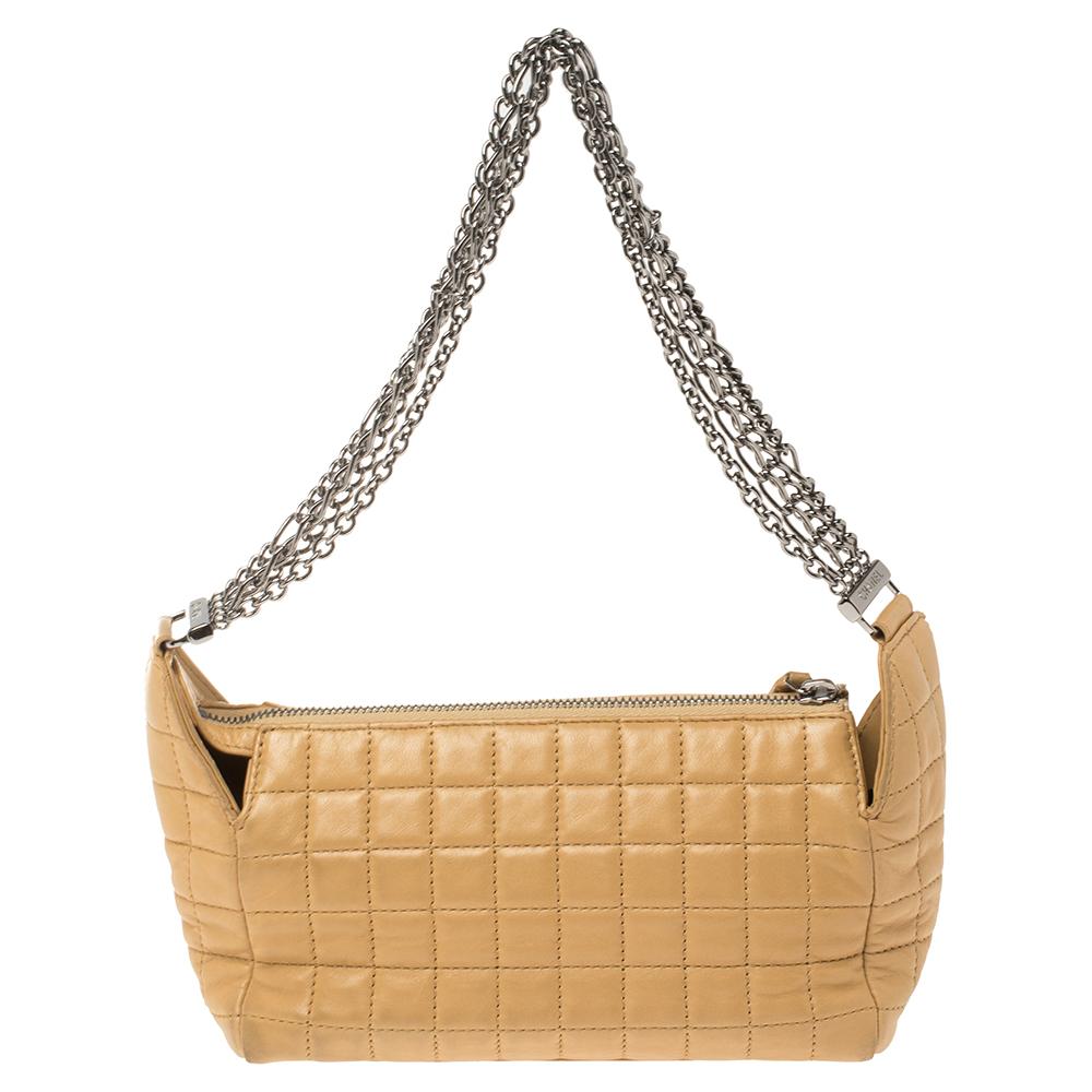 A bag to complement both Chanel lovers and handbag admirers is this one. It is made from leather and features the chocolate bar quilt on the exterior. The bag is held by multiple silver-tone chain handles and has a zipper that secures the fabric