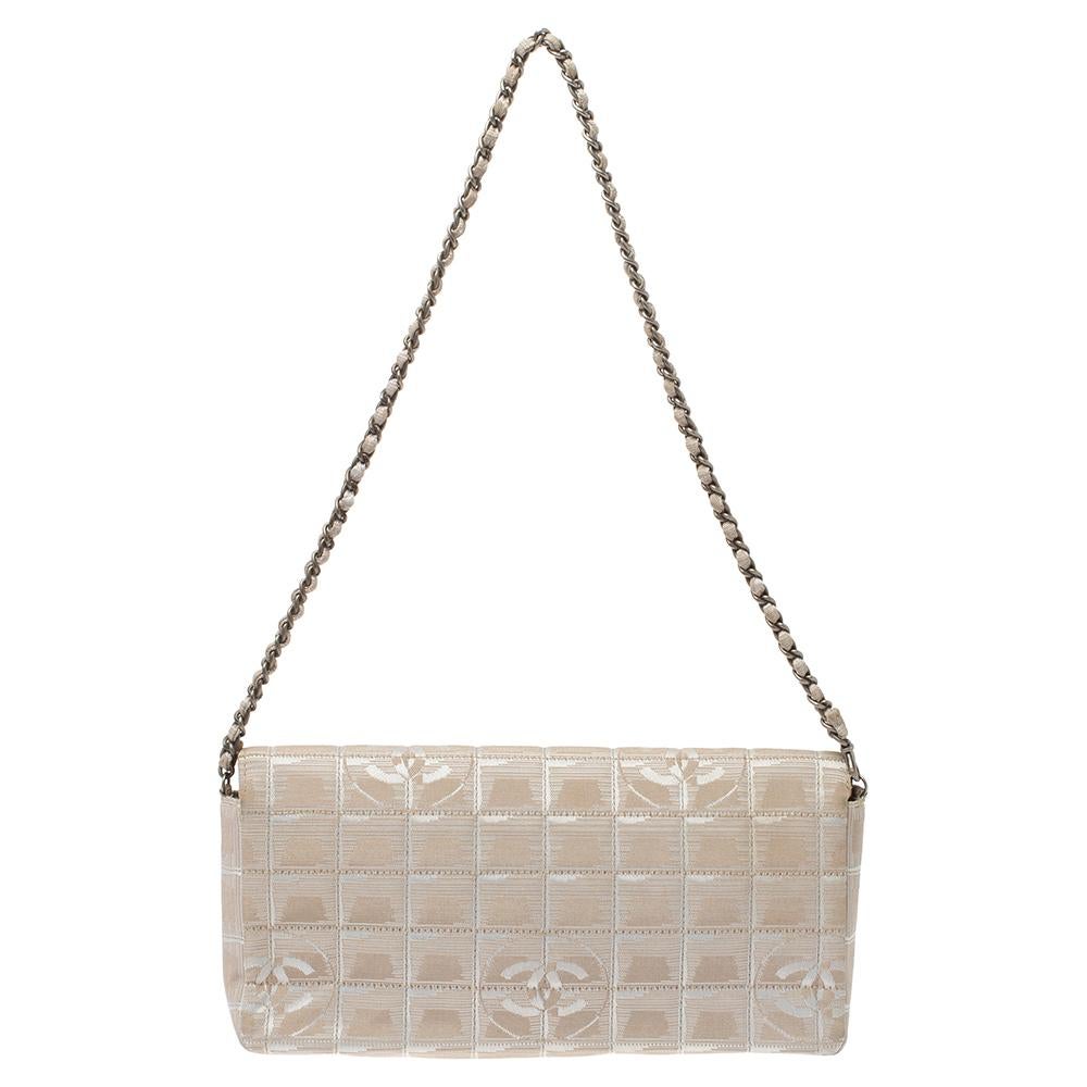 A chic and sophisticated Chanel East/West Small Flap Bag is just the perfect accessory for evenings and special occasions. This bag is the perfect way to carry your girly essentials when you are looking for something a little dressier. This beige
