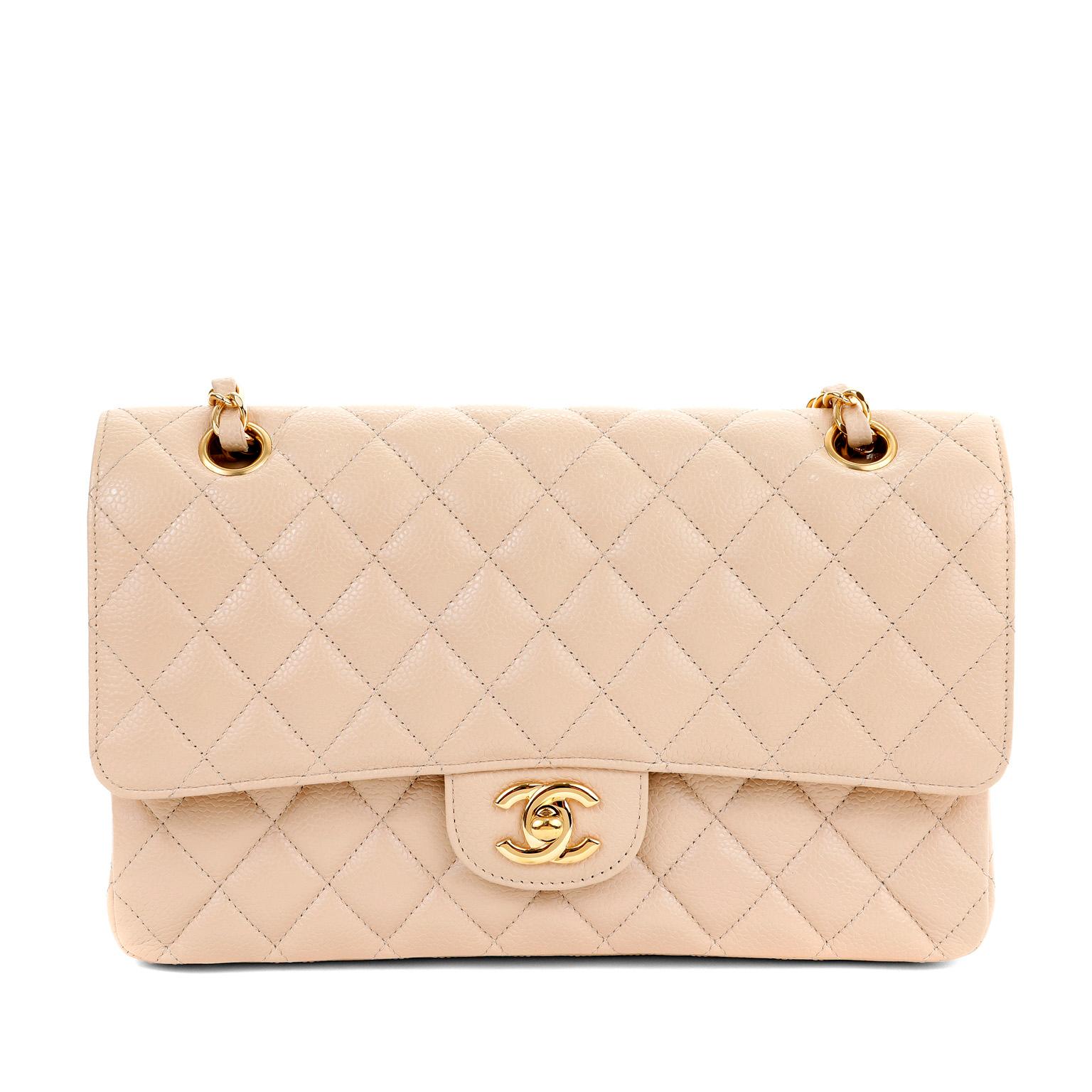 This authentic Chanel Beige Clair Caviar Leather Medium Classic Flap Bag is in pristine condition.  A key piece in any sophisticated wardrobe, the Classic Flap is one of the most sought-after Chanel styles produced.  Beige Clair is nearly impossible