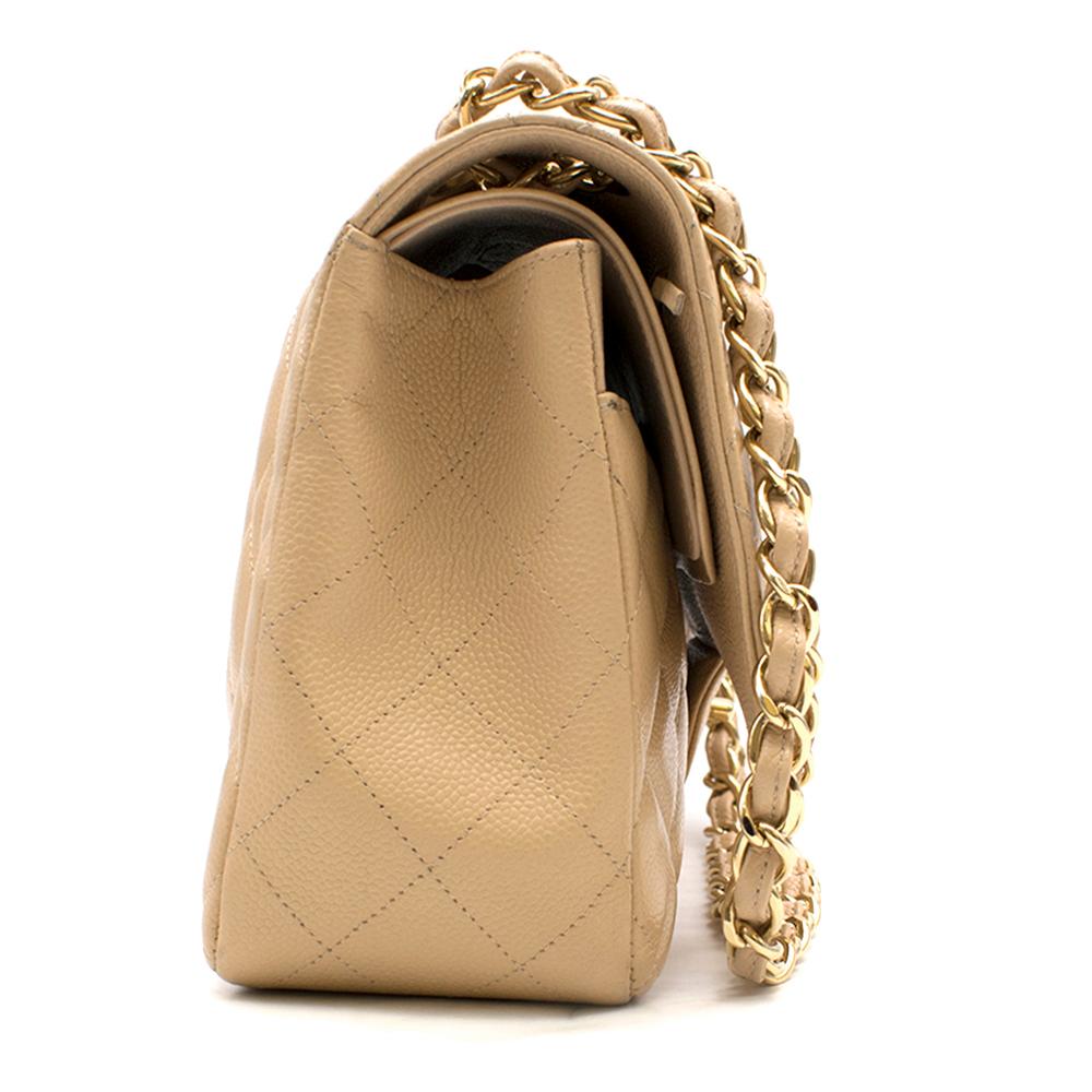 Chanel Beige Clair Lambskin Classic Jumbo Double Flap   

- Golden hardware
- Caviar leather in beige
- Interior: 1 Large  compartment, 2 Large Pockets.
- Exterior: 1 Exterior Back Pocket. 
- Closure: Front Flap with Gold hardware 