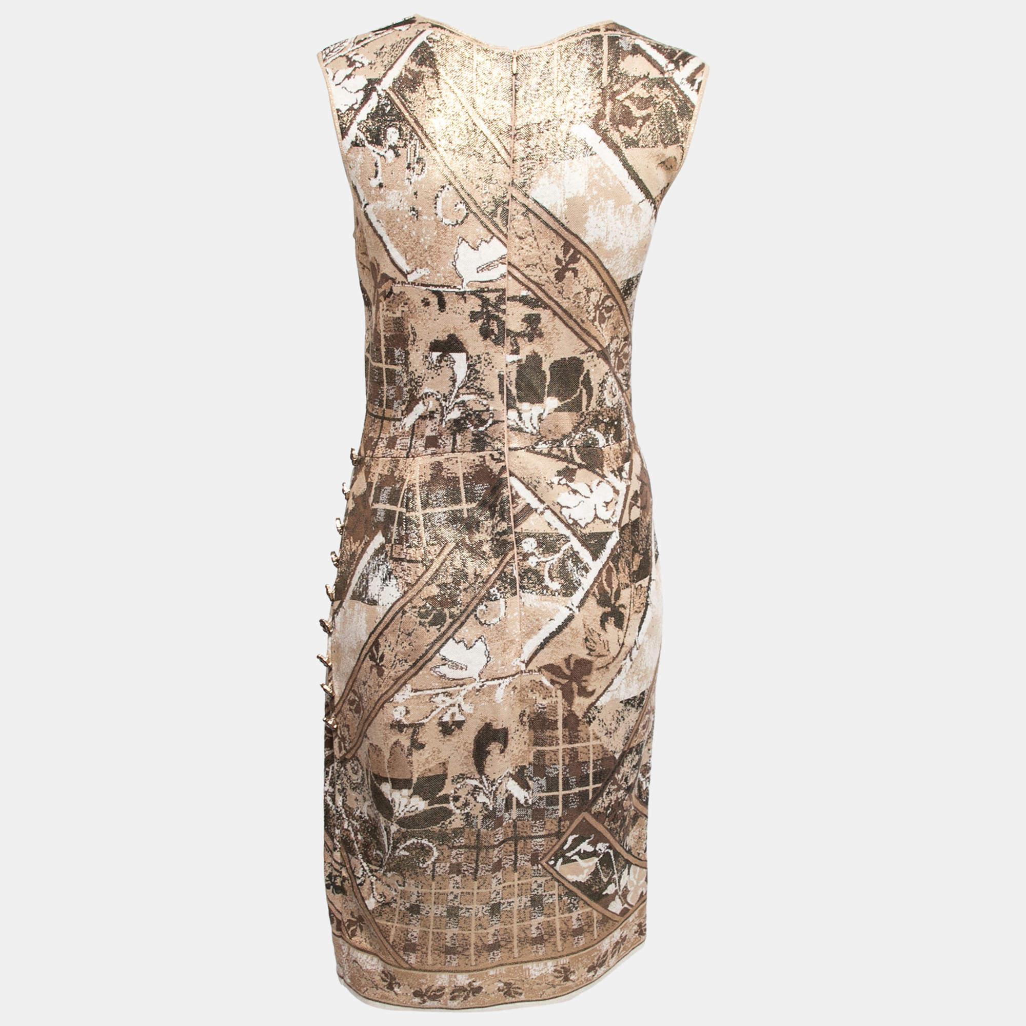 The House of Chanel brings you this stunning dress which is a perfect fit for your luxury wardrobe. It is fashioned in beige-gold jacquard knit fabric and is embellished with buttoned accents. It exhibits a sleeveless style and a zipper closure.