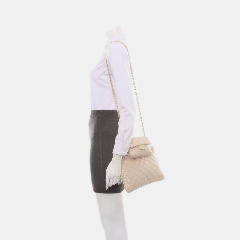 Chanel Beige Iridescent Lambskin Quilted Pouch with Mini Flap Purse
 These are professional photos of the actual bag.
 Chanel Pouch bag with a mini flap purse in front, fitted with a matelasse chain. This comes with an additional unoriginal chain