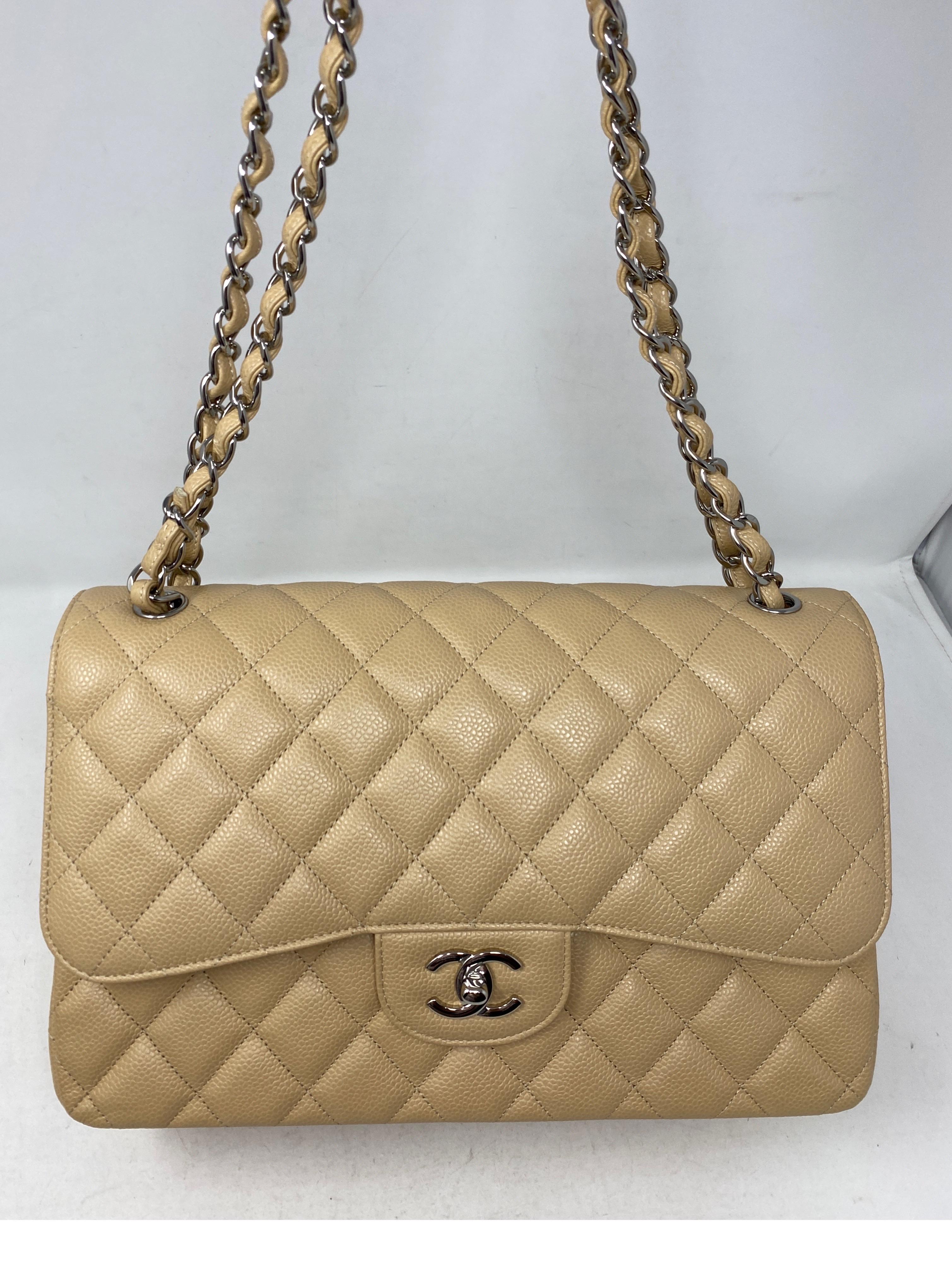 Chanel Beige Jumbo Double Flap Bag. Light cream color caviar leather bag. Silver hardware. Excellent like new condition. Most wanted color for the season. Can be worn crossbody or as a shoulder bag. Includes authenticity card. Guaranteed authentic. 