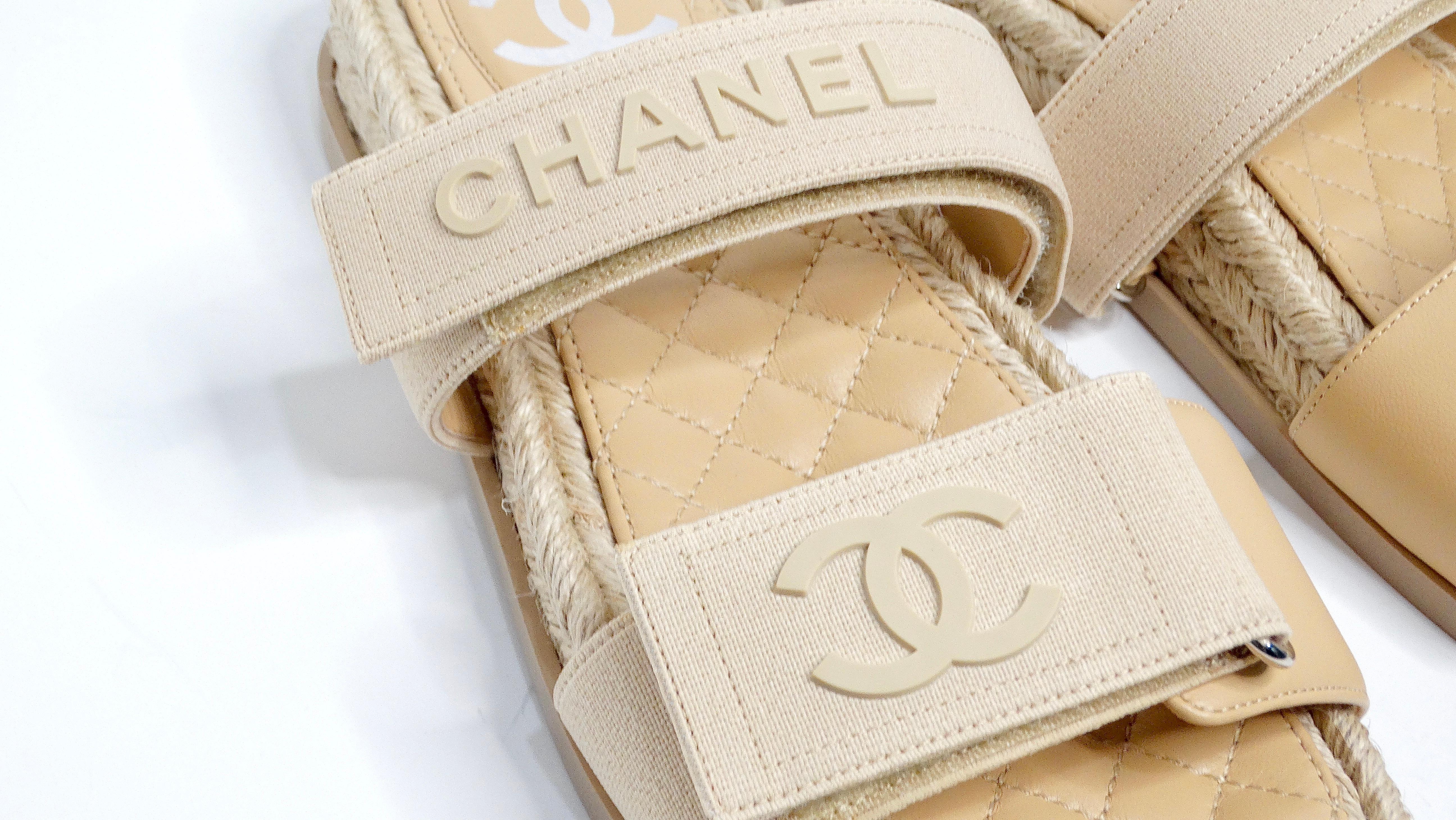 The Chanel Beige Lambskin Espadrille Strap Sandals are the epitome of understated elegance, blending comfort and sophistication in one beautiful package. These sandals feature soft beige lambskin leather, with the iconic CC logo adorning the toe