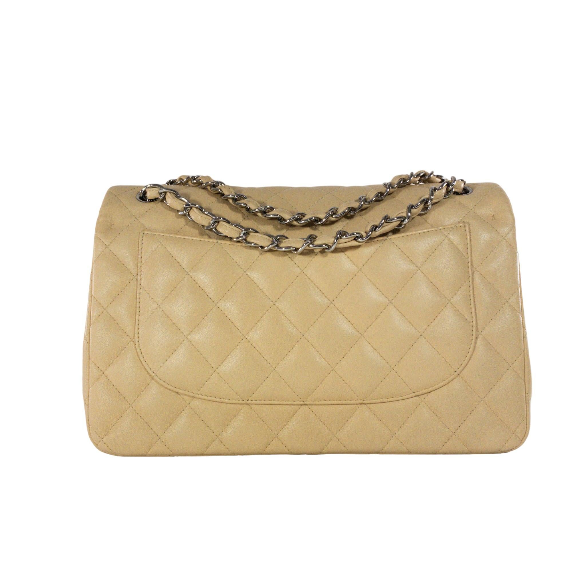 Consign of the Times presents this Chanel Beige Lambskin Jumbo Classic Flap with Silver Hardware.

This is an authentic Chanel beige lambskin Jumbo. The bag is a double flap with classic Chanel diamond quilting. The bag has a flap closure with a