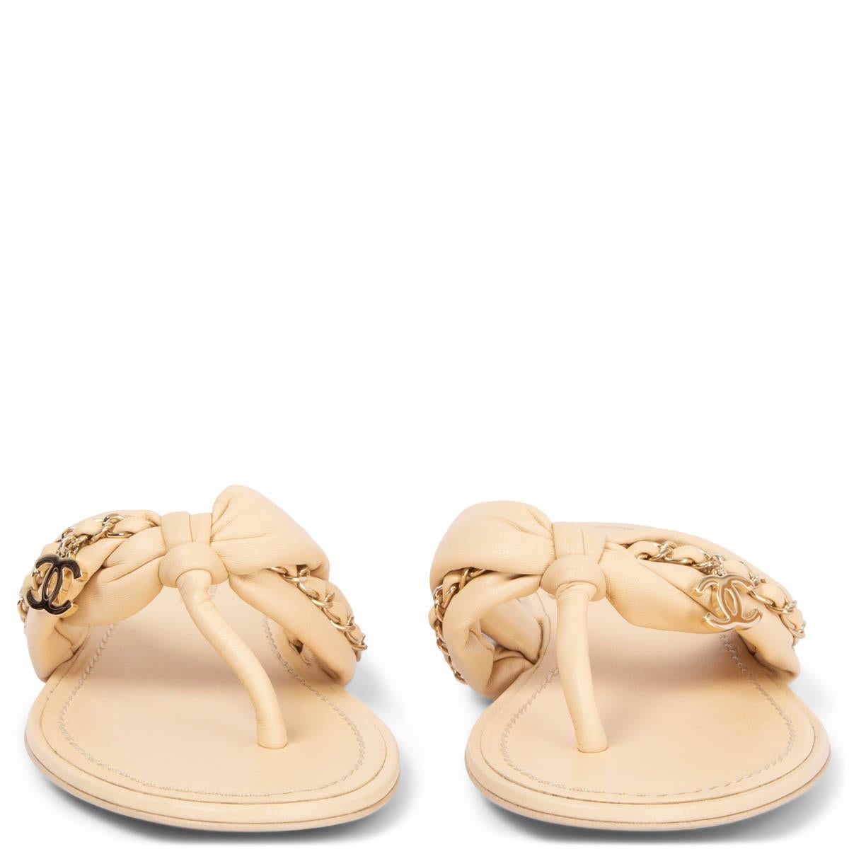 100% authentic Chanel flat thong sandals in light beige lambskin leather embellished with a gold-tome chain detail and CC dangling logo. Brand new. Come with dust bag. 

2022 Spring/Summer

Measurements
Model	Chanel22S G38210
Imprinted Size	39 (run