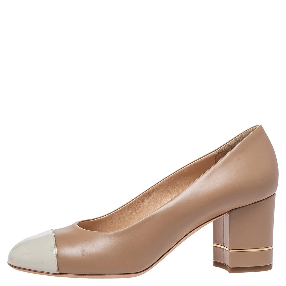 Chanel pumps are the epitome of class and elegance. Be at par with the latest trends in the world of fashion when you wear these beige and white pumps. They are made from patent leather & leather and styled with round cap toes, 7 cm block heels