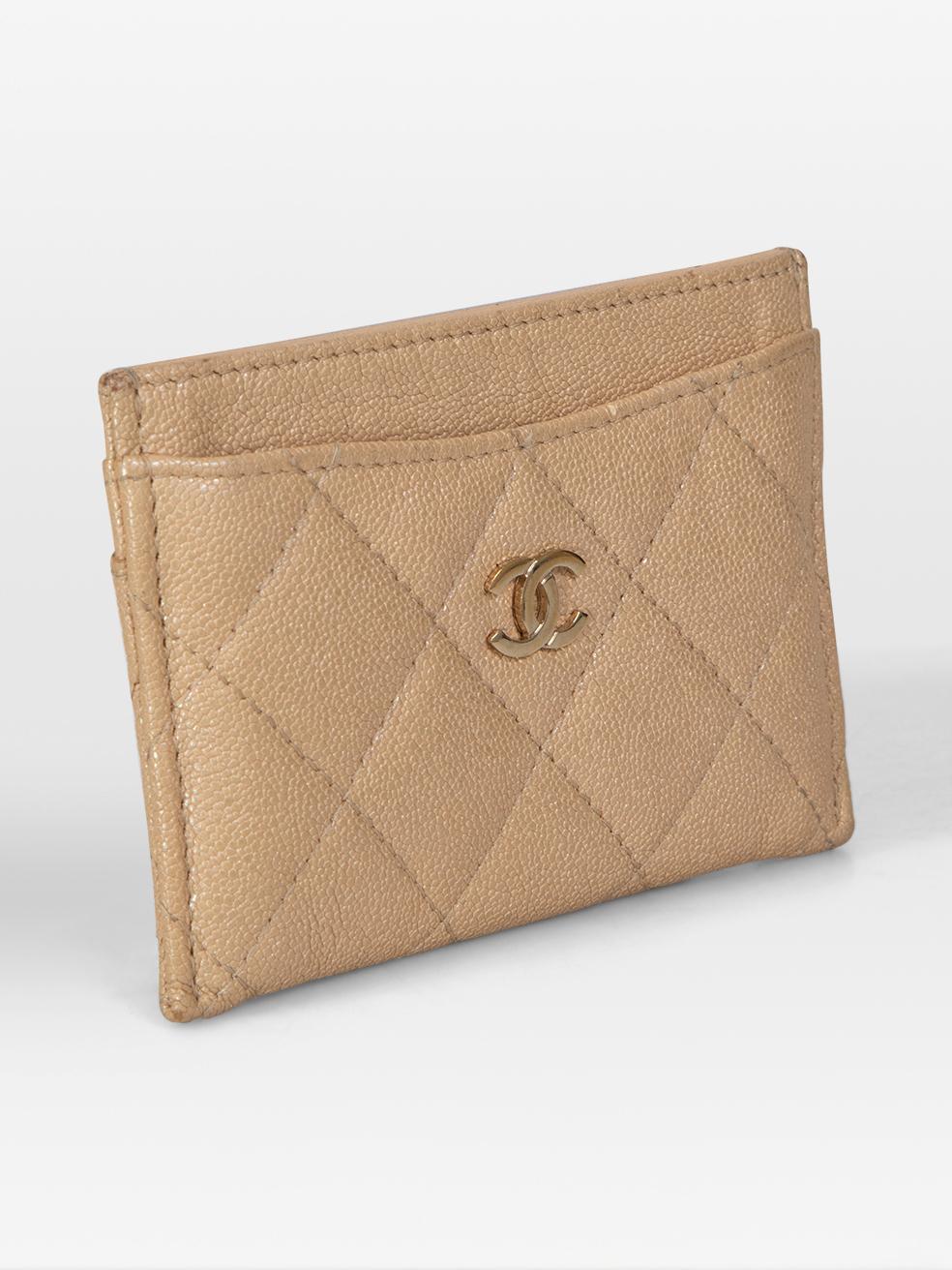 CONDITION is Very good. Minimal wear to the card holder is evident. Discolouration on the four corners. Scratching and tarnishing to the centre front logo on this used Chanel designer resale item. This card holder comes in the original box and dust