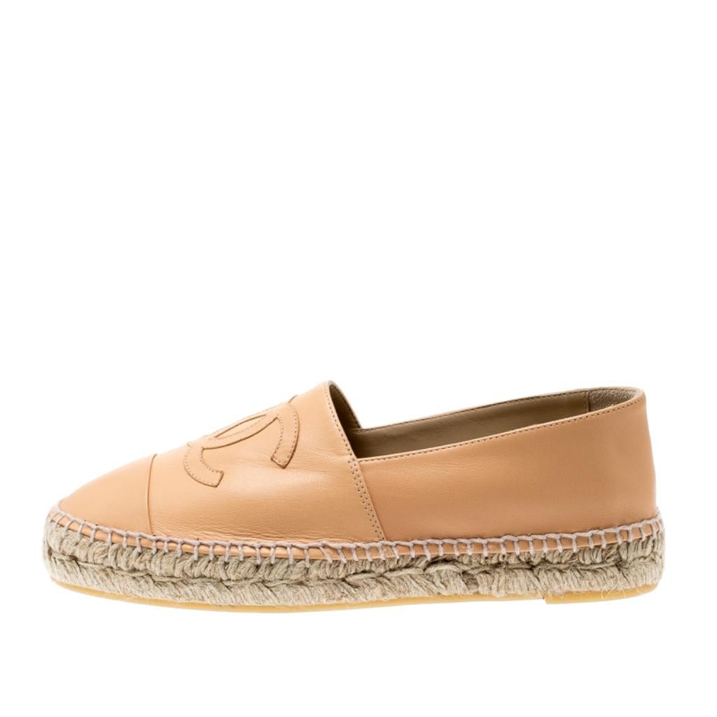 Espadrilles are not just stylish, but also comfortable and easy to wear. This lovely pair from Chanel will accompany a casual outfit perfectly. They are made of beige leather and detailed with the CC logo on the uppers.

Includes: Info Booklet,