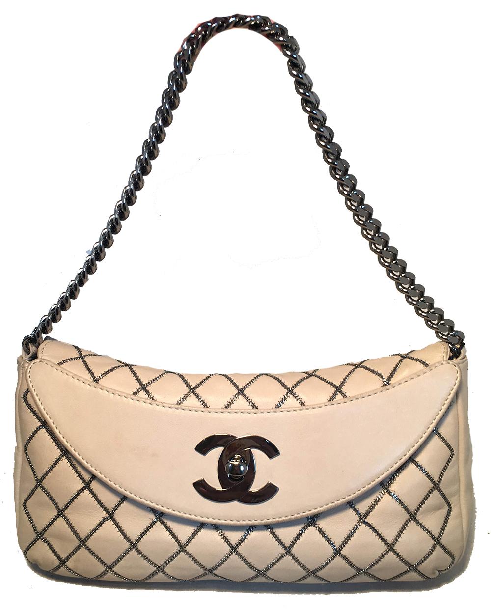 Chanel Beige Leather Gunmetal Chain Quilted Classic Flap Shoulder Bag in very good condition. Soft beige quilted lambskin leather exterior trimmed with gunmetal hardware and delicate chain quilted signature diamond pattern along front side. Twisting