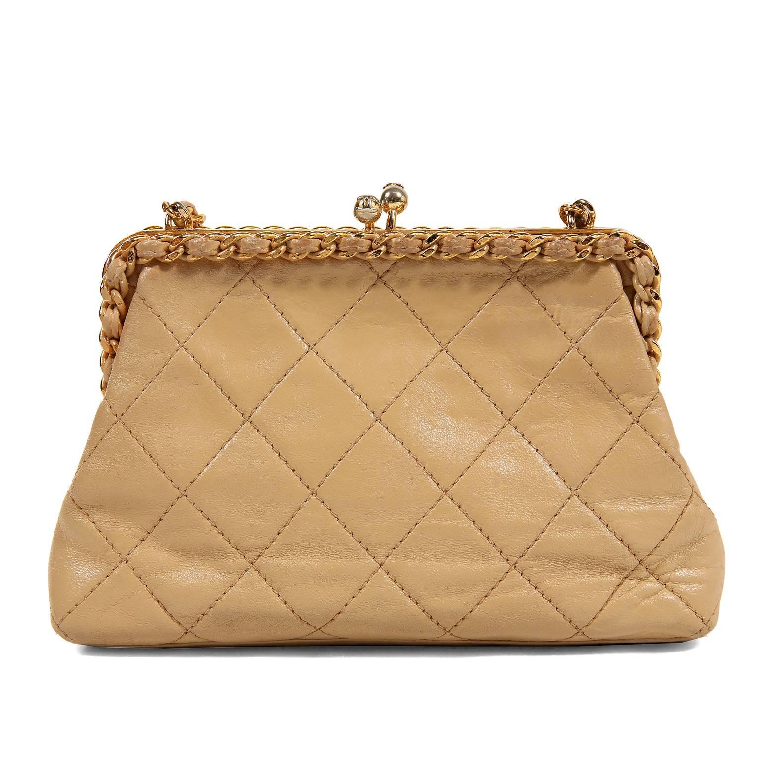 Chanel Beige Leather Kiss Lock Bag- Excellent Vintage Condition
From the early 1990’s, this classic design is a must have for any collection.   
Small framed beige leather bag is quilted in signature Chanel diamond pattern.  A single leather and