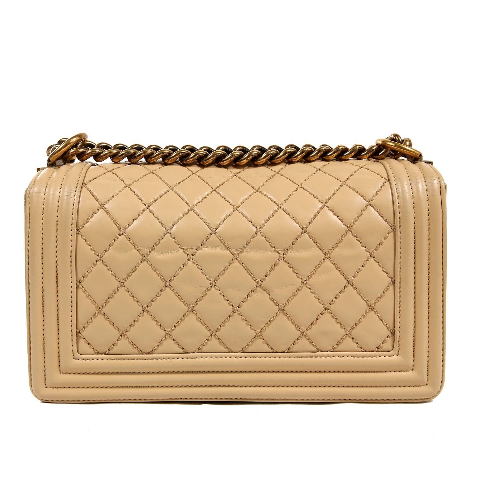 Chanel Beige Leather Medium Boy Bag- Limited Edition; Near Pristine Condition
The updated design is structured and edgy with a versatility that makes it extremely popular.

Warm beige lambskin is quilted in signature Chanel diamond stitched pattern