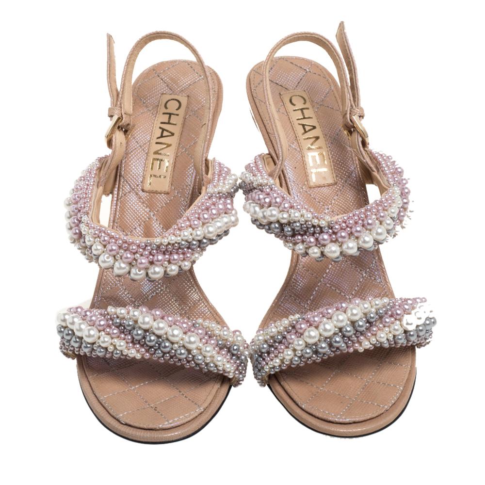 These sandals from Chanel have been designed to deliver effortless style and comfort. Crafted in Italy, the lovely exterior is beautified with faux pearls. They are finished with buckled slingbacks and high heels.

Includes: Original Dustbag
